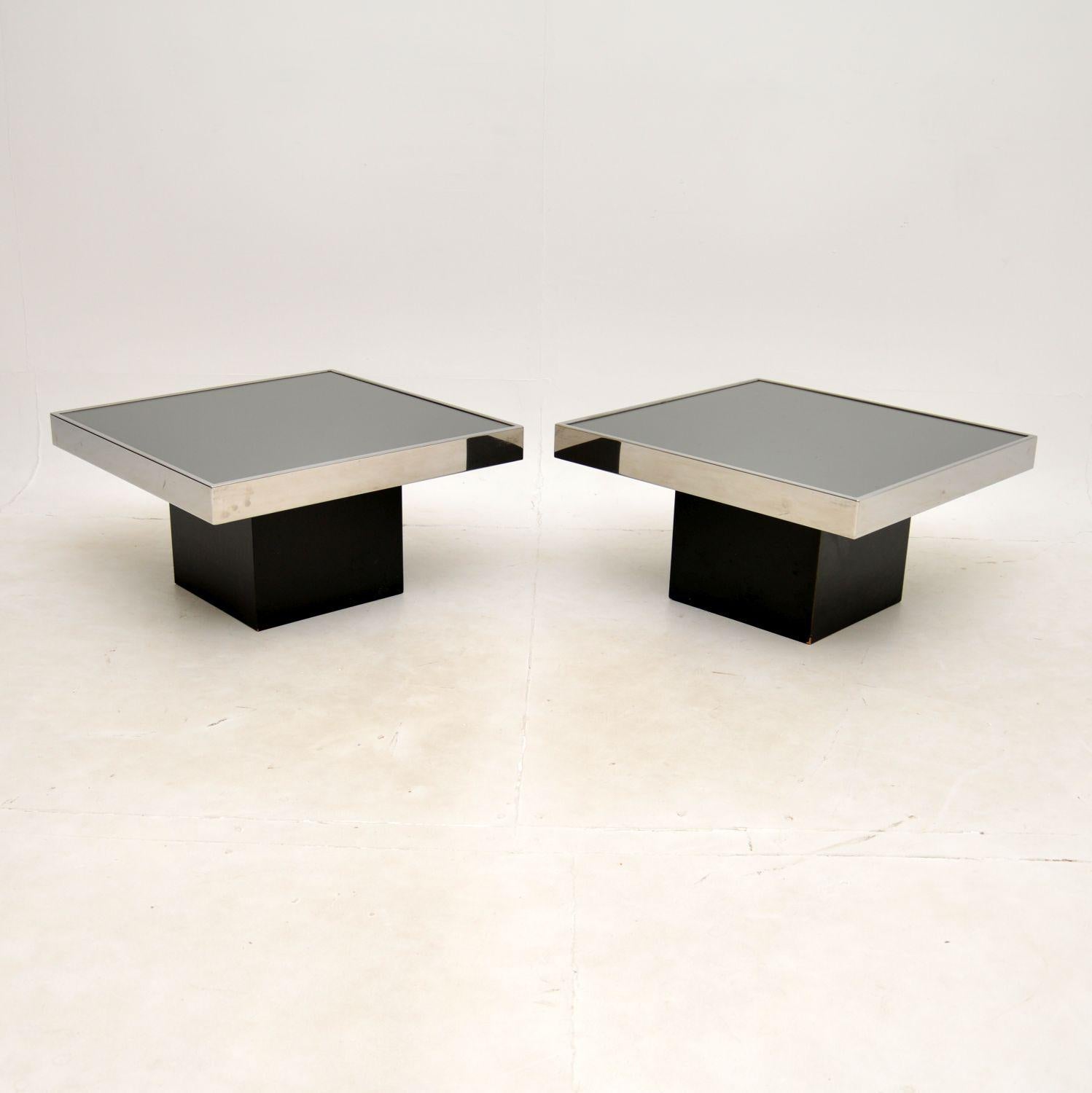 A very stylish and extremely well made pair of vintage Italian side tables by Willy Rizzo for Cidue. They were made in Italy, and date from the 1970’s.

The quality is outstanding, the slightly smoked mirrored tops are set within chrome frames, and