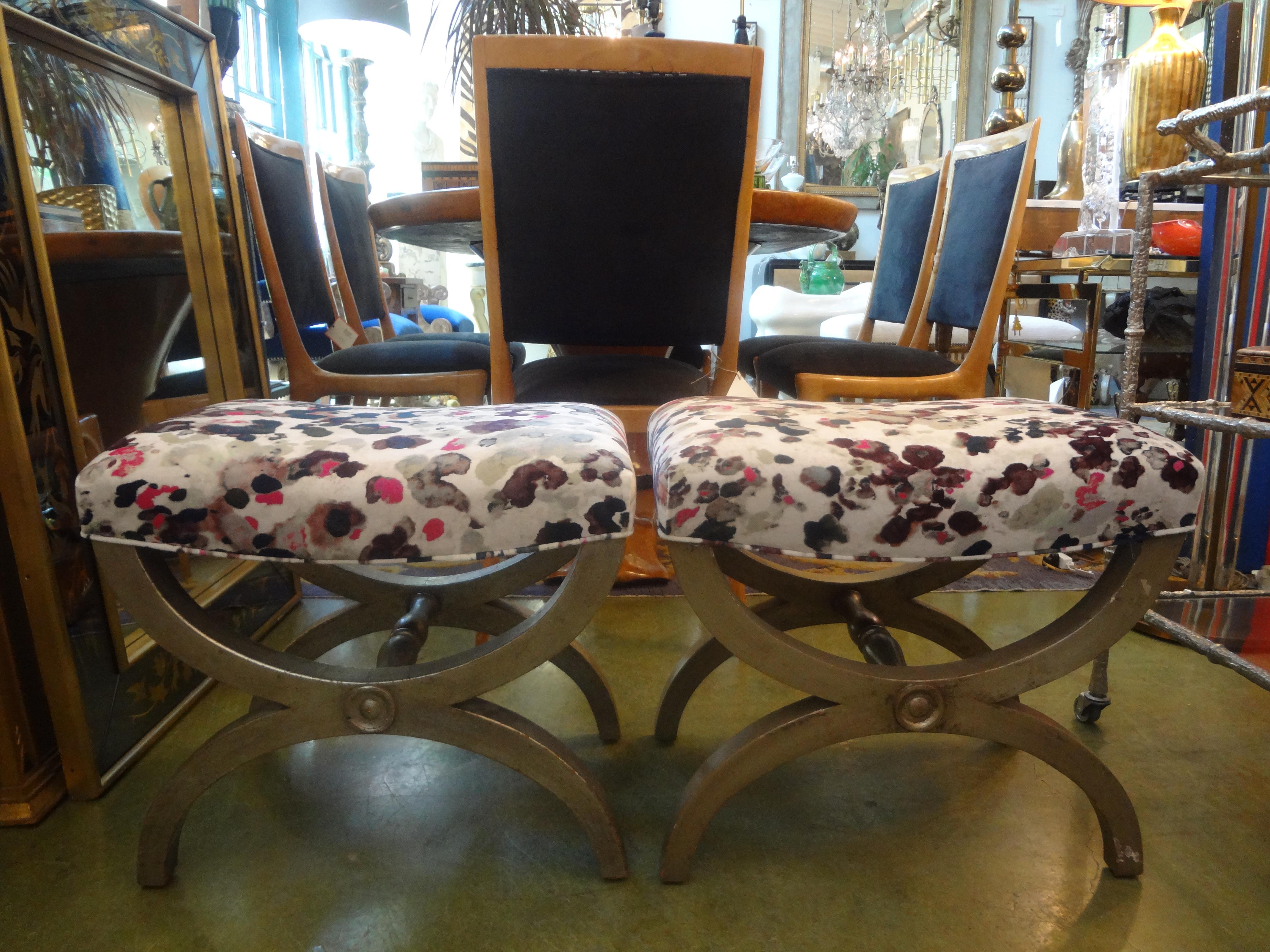 Stunning pair of vintage Italian silver giltwood or silver leaf benches or ottomans. This matching pair of x shaped silver benches, stools or ottomans are good sized and usable for extra seating where needed. These gorgeous Italian silver gilt wood