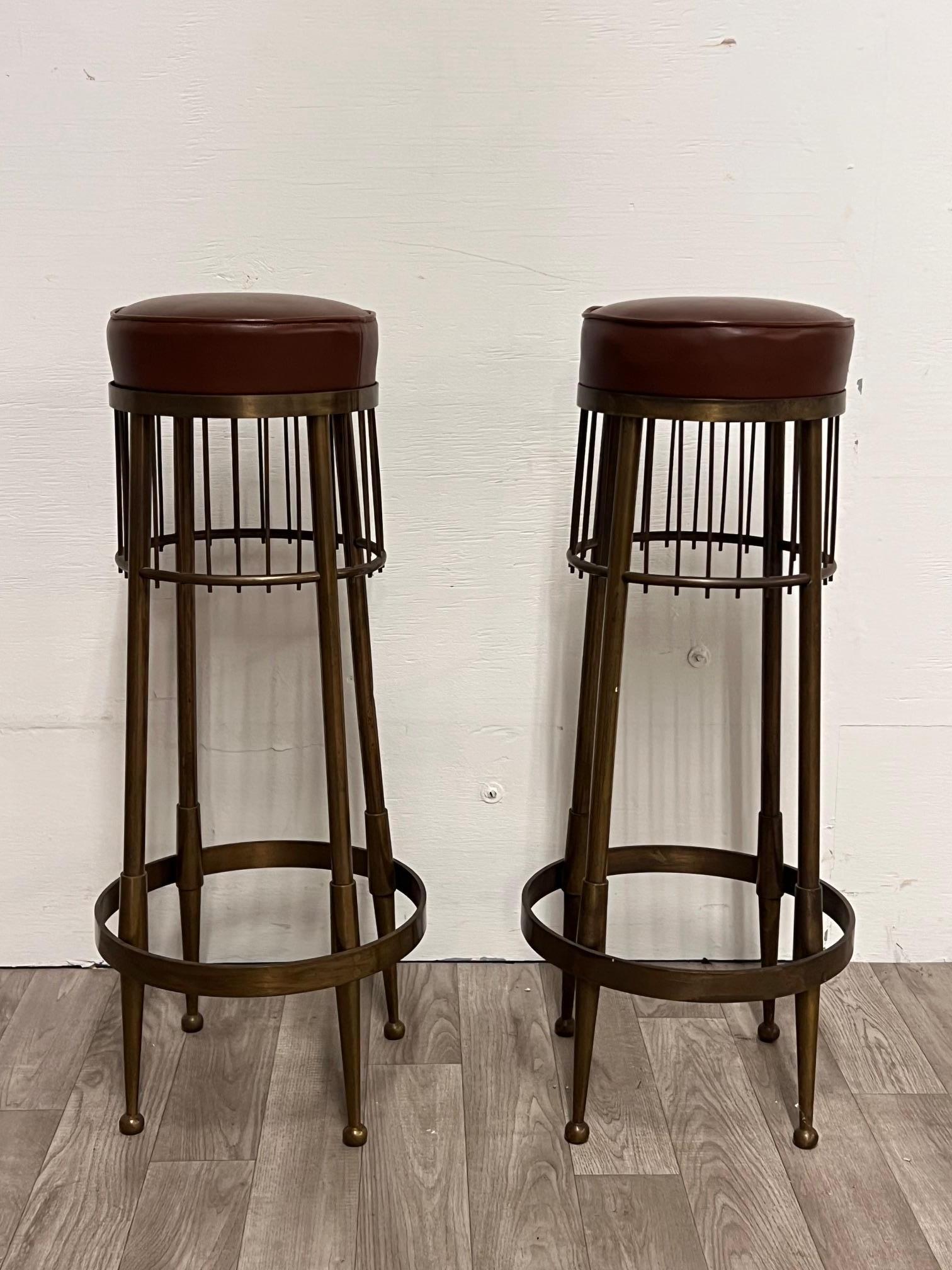 Pair of unique vintage Italian Stools
Nice Patina
Italian Craftsmanship at its best

The combination of the brown leather seats and brass like finish gives them a very nice look in any space 

Seat diameter is 9.5