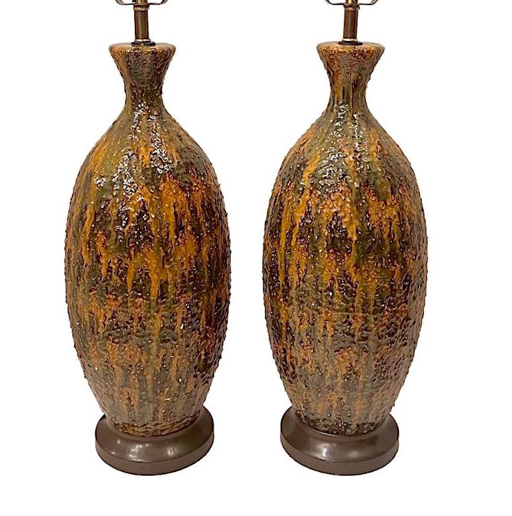 Pair of circa 1950's Italian ceramic table lamps with glazed finish.

Measurements:
Height of body: 20.5