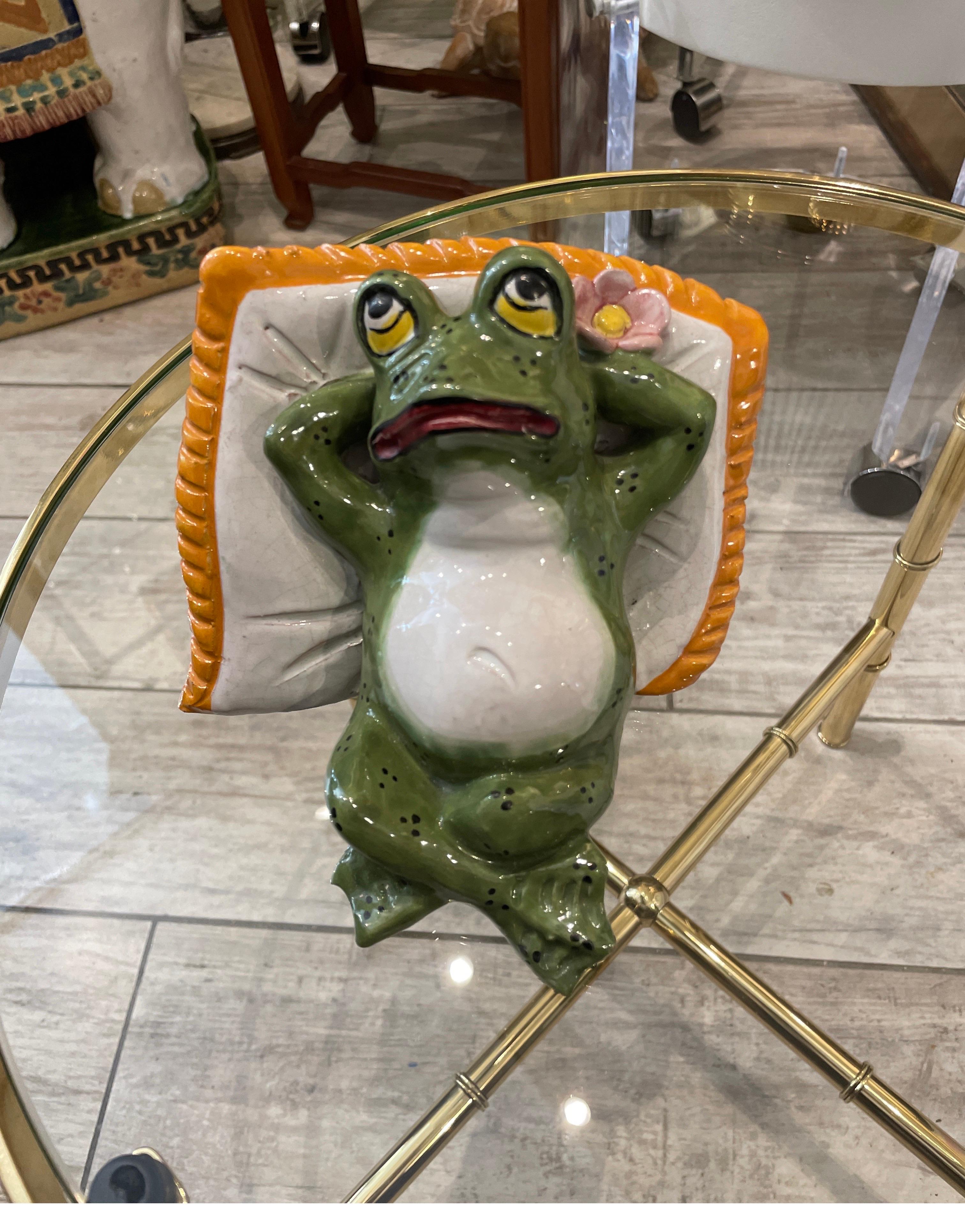 Very sweet pair of bookends depicting frogs reclining on a pillow. These are hand painted glazed terracotta &made in Italy. 
