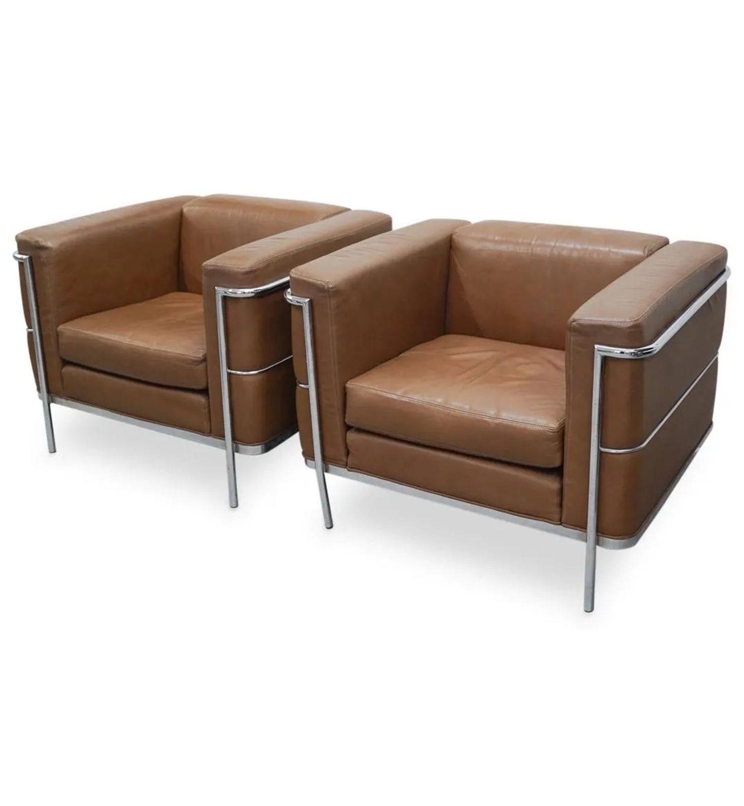 Pair of vintage club chairs upholstered with nutmeg brown leather and supported by chrome frames. Made in c. 1983 by Jack Cartwright Design.
Dimensions:
27
