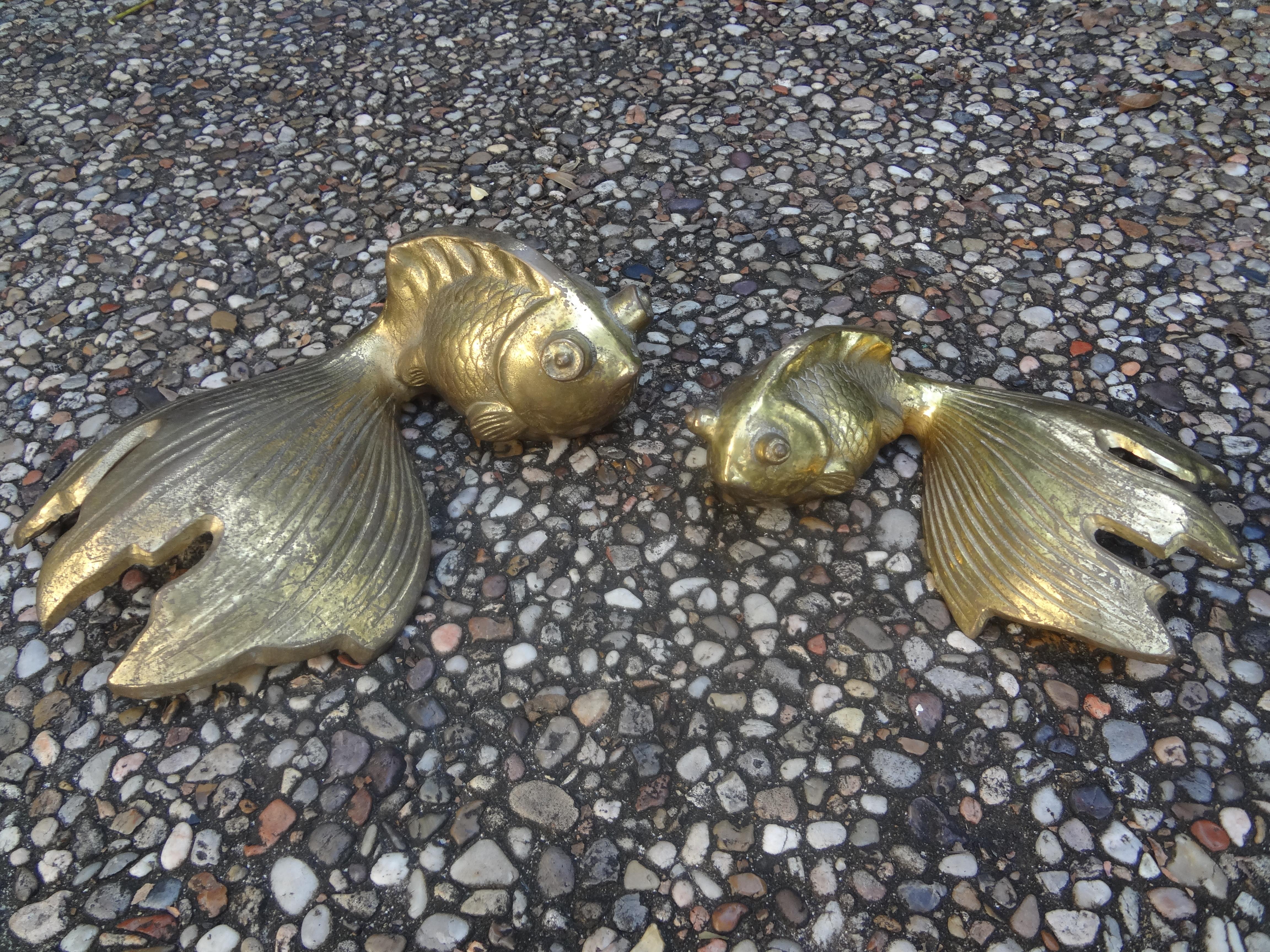 Pair of Vintage Japanese brass Koi Fish. These great brass Koi are a complimentary pair. One is larger than the other. 
Dimensions:
Large-
3.5