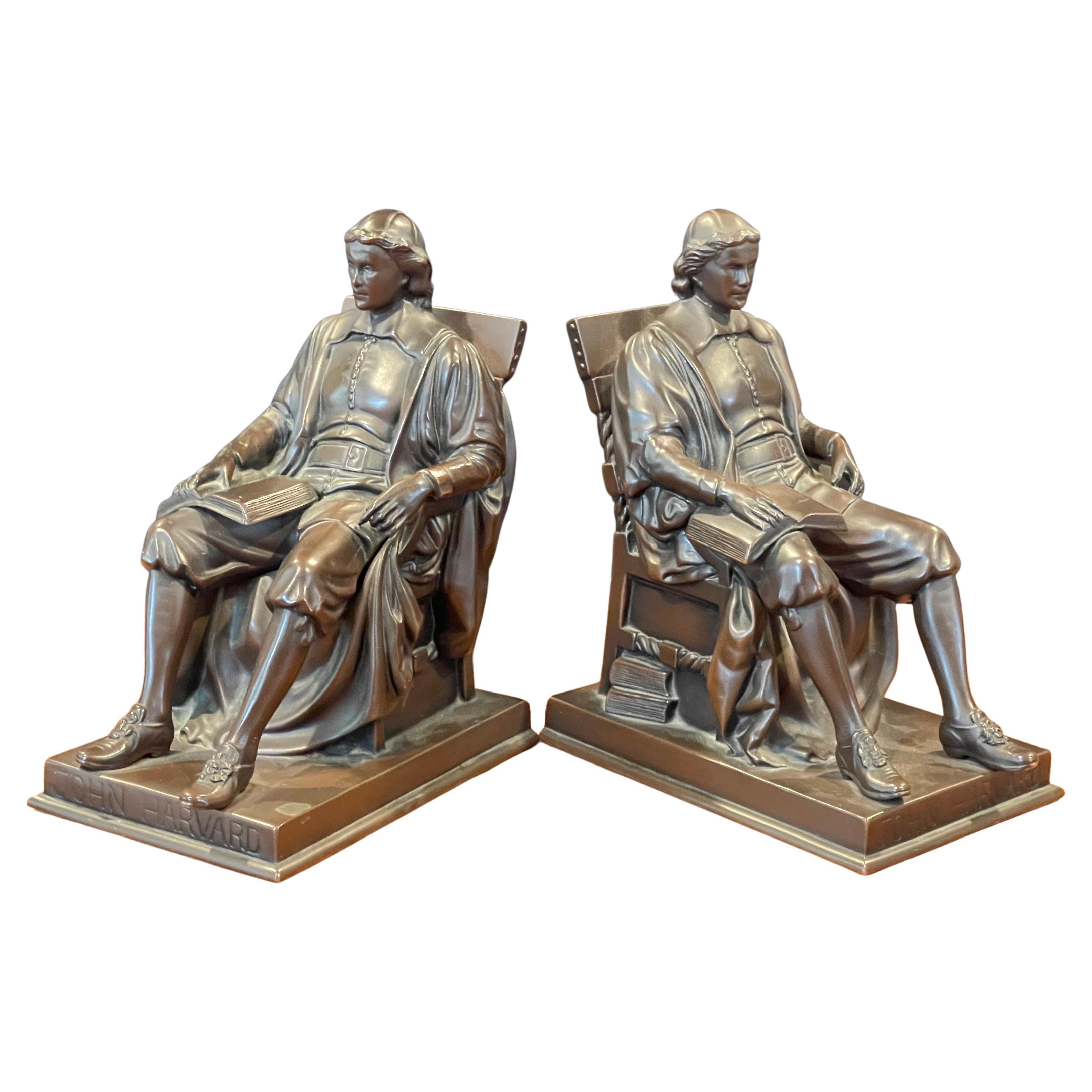 A pair of vintage John Harvard bronze bookends by Jennings Brothers metal foundry modeled after Daniel Chester French's life-sized bronze original which stands in Harvard Yard in Cambridge, MA., circa 1940s.  The set are well casted, heavy and in a
