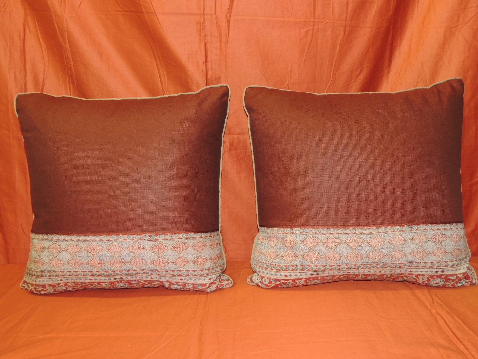 Pair of vintage Kalamkari Indian square decorative pillows.
Indian hand-blocked textile decorative pillow. Hand-blocked border at the bottom of the Kalamkari decorative pillow framed with rust-colored textured linen and embellished with a rust color