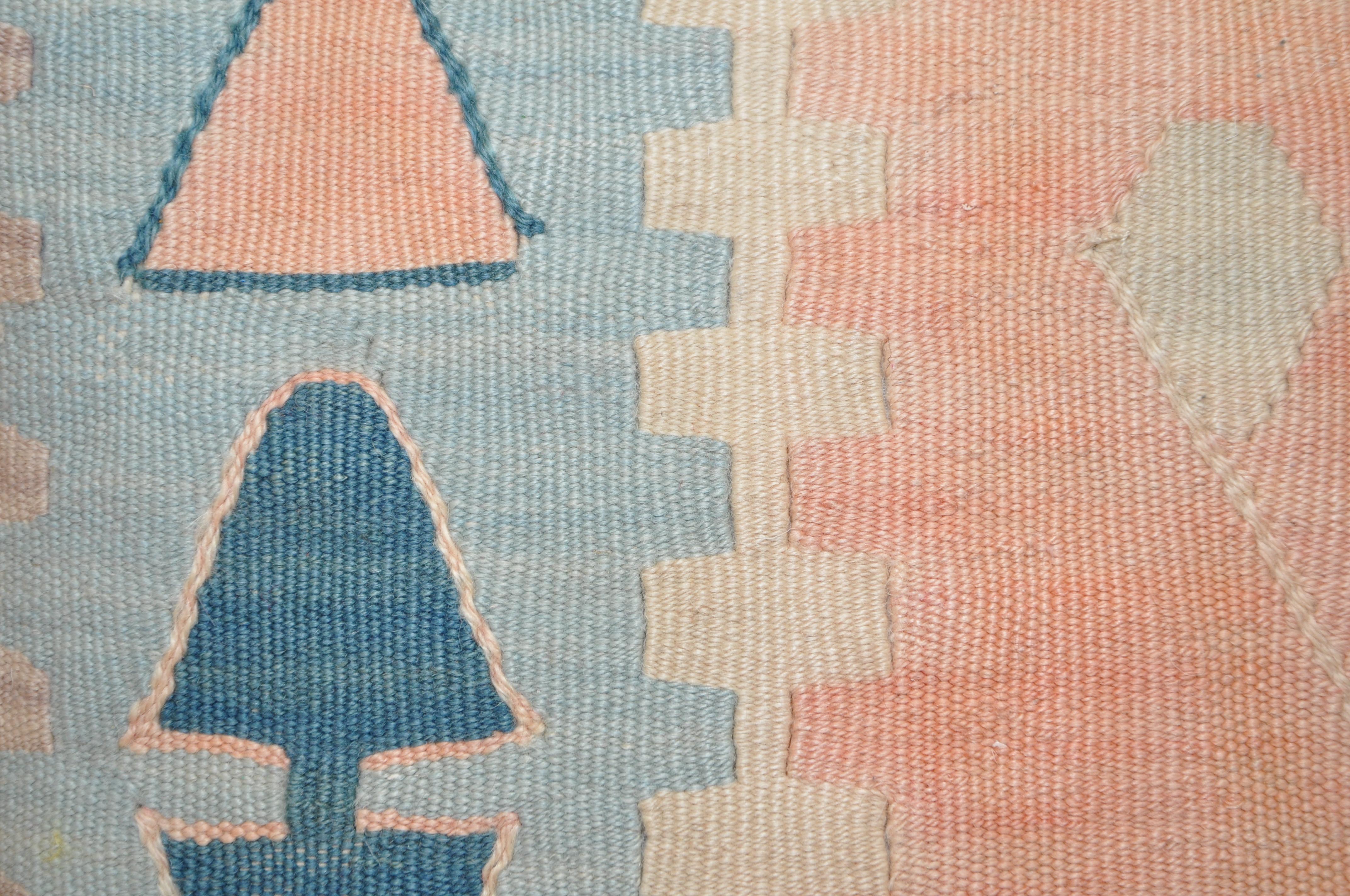 Pair of luxury pillows created from exquisite pieces of vintage kilim rug combined with Irish Linen by Irish designer Katie Larmour. Unique and one-of-a-kind. 

In beautiful geometric shapes of soft faded blue and blush pink.

Each cushion is