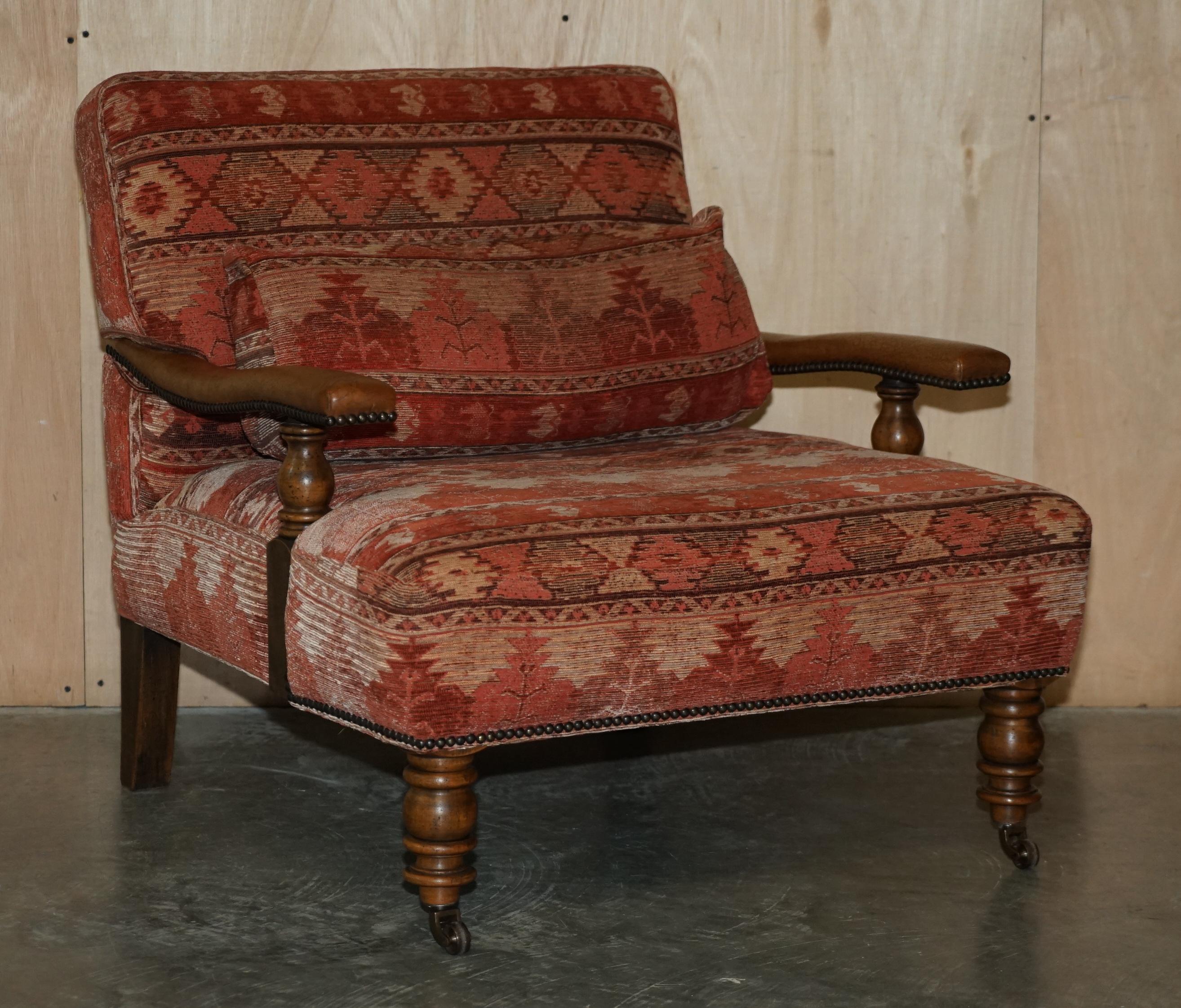We are delighted to offer for sale this stunning pair of hand made vintage Kilim Library reading armchairs with hand dyed brown leather arms and lumbar support cushions that are feather filled

A very good looking well made and decorative pair of