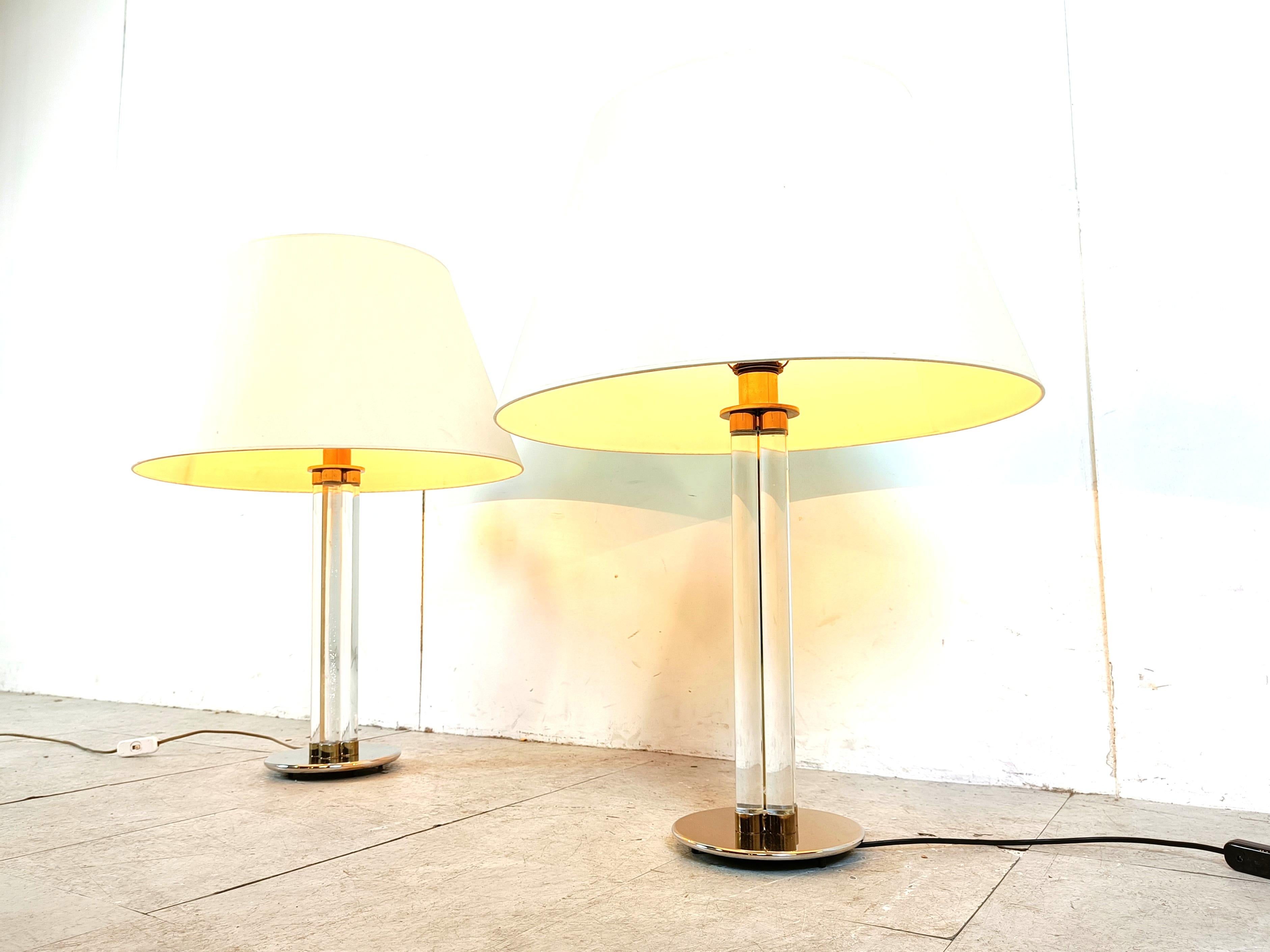 Pair of large lucite table lamps.

They where acquired from a large mansion in Belgium and are very stately lamps.

Good condition

Tested and ready to use with a regular E27 light bulb

1970s - Belgium

Dimensions:
height: 80cm
Diameter: