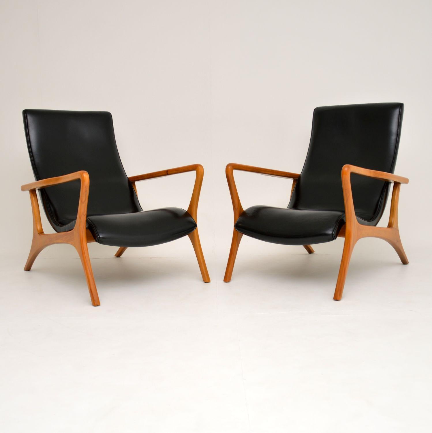 An amazing pair of vintage armchairs with an absolutely stunning design. They are highly influenced by Vladimir Kagan’s ‘Contour’ armchairs, though we are not sure who made these.

They are of amazing quality, with finely sculpted solid wood