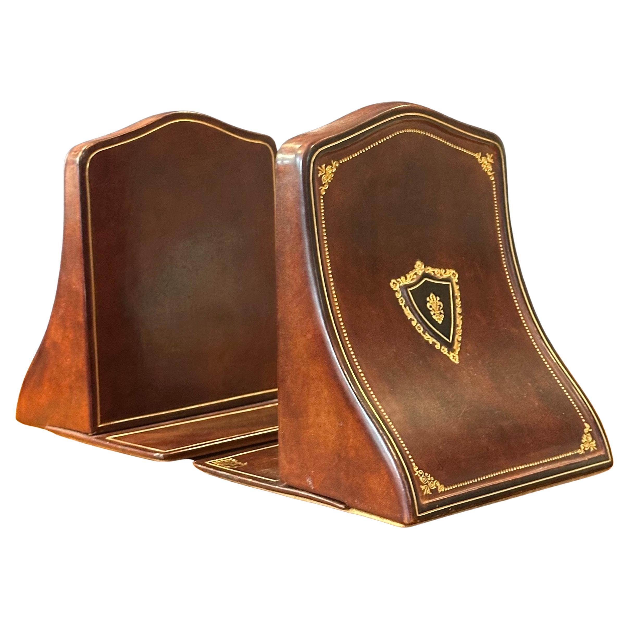 A beautiful pair of well crafted vintage leather bookends by Papini of Firenze, Italy, circa 1980s. The pair are in very good vintage condition and and are signed on the base. Exceptional quality!   #4295