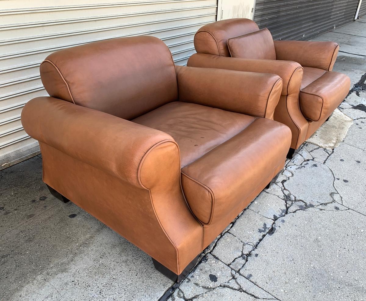 Beautiful pair of club chairs designed and manufactured in Canada by Nienkamper.

The chairs are large in size and upholstered in very soft brown Leather, they are gently used and have lots of life left in them.Extremely comfortable and with