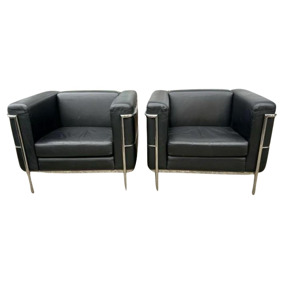 A pair of Vintage lounge or club chairs in the style of Le Corbusier. Wide Model LC3 in Soft Black Leather. Triple chrome plated steel frame. Chairs shows little signs of use very comfortable chrome is in great condition. Manufactured by Jack