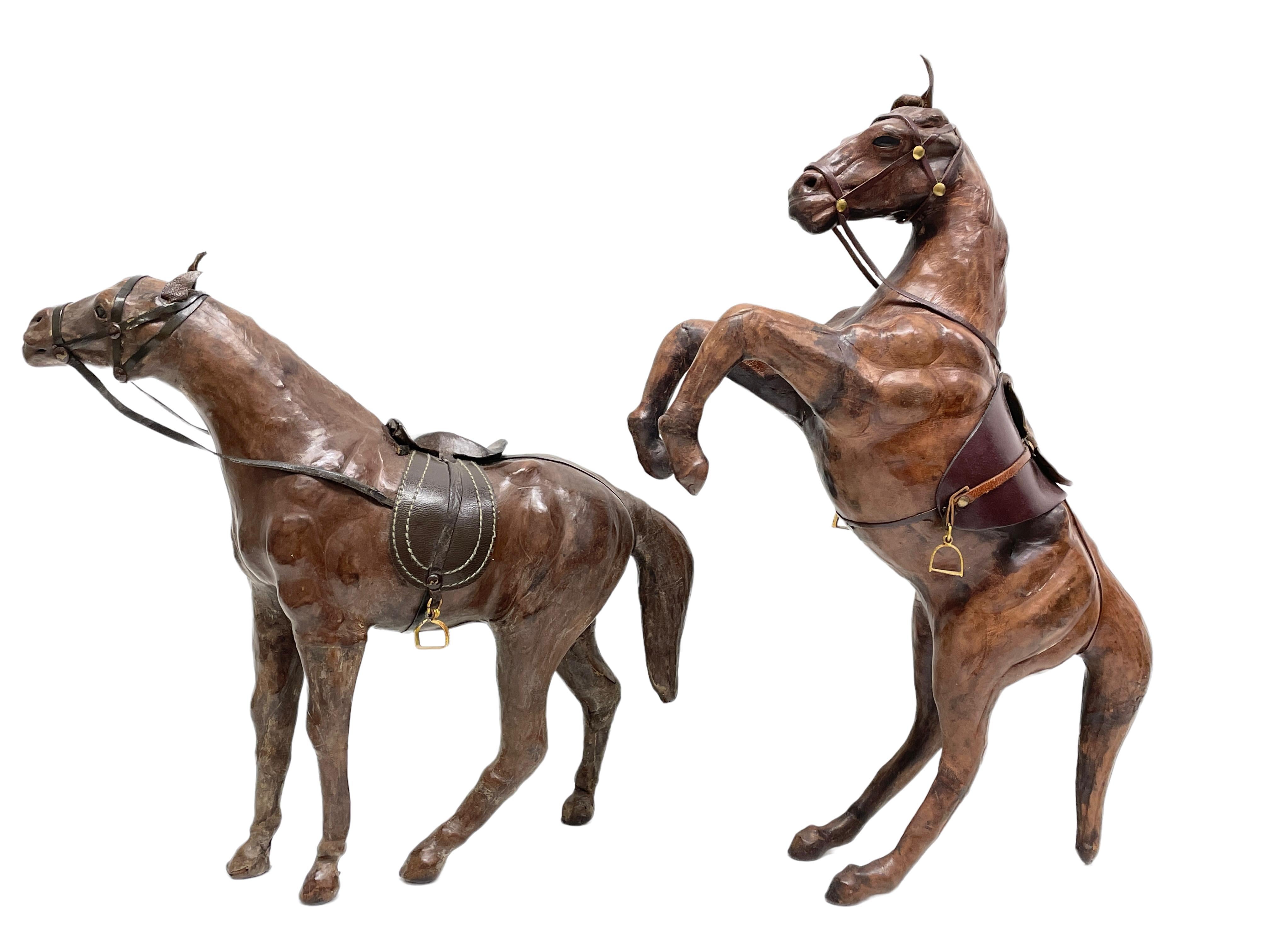 Pair of horse sculptures in leather in the style of Dimitri Omersa for Abercombie & Fitch
Unmarked. Brown tones, Glass eyes and brass parts.
Standing horse: 16.25