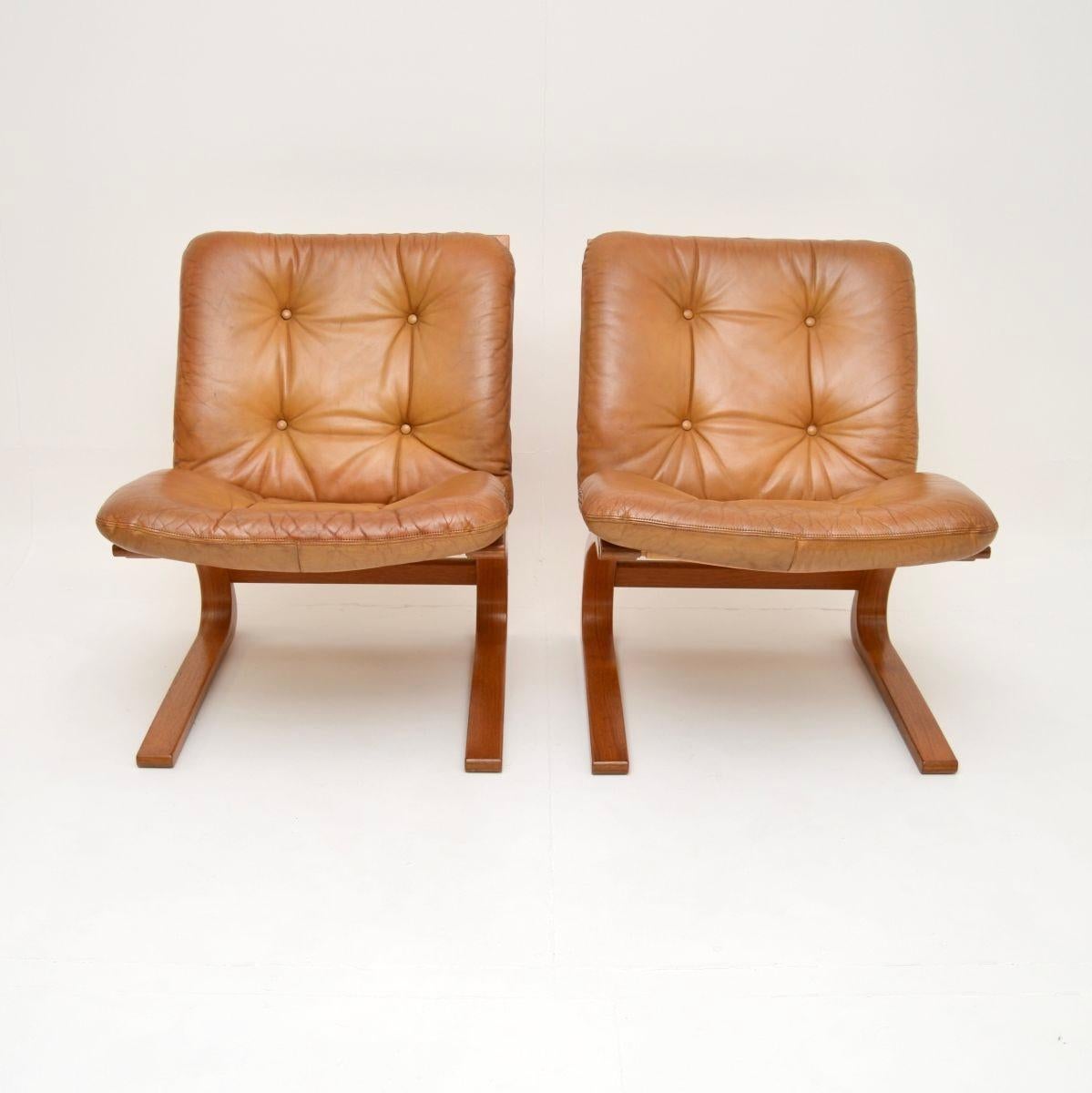 A stylish and extremely comfortable pair of vintage leather Kengu chairs by Elsa and Nordahl Solheim for Rykken. They were made in Norway, they date from the 1970’s.

The quality is exceptional, they are beautifully designed and are really, really