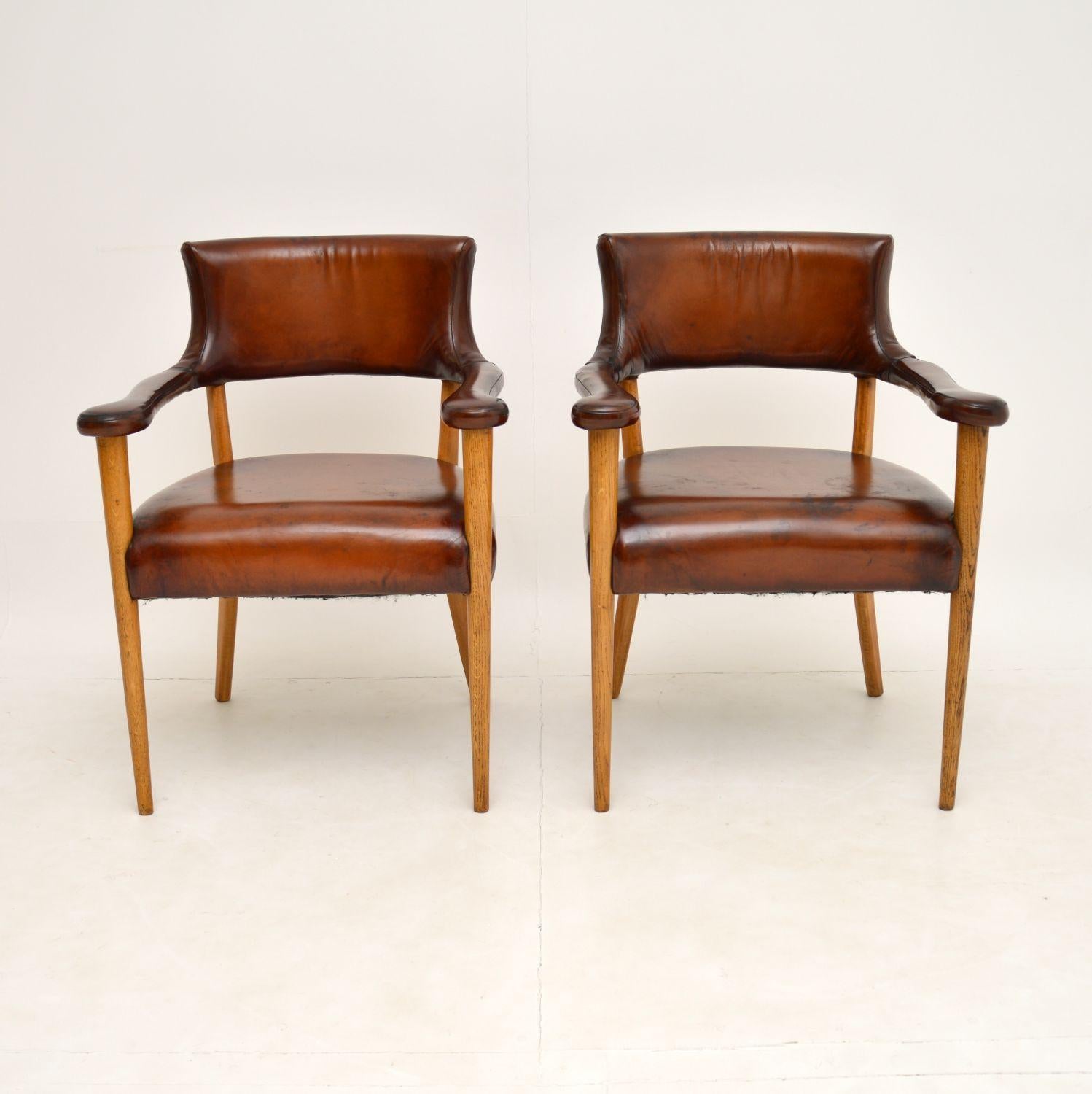 A stunning and very unusual pair of open leather armchairs, dating from around the 1960’s. These look like they could be Danish or Swedish, we are not sure of the origin.

They are beautifully made and designed, with shapely back rests and arms.