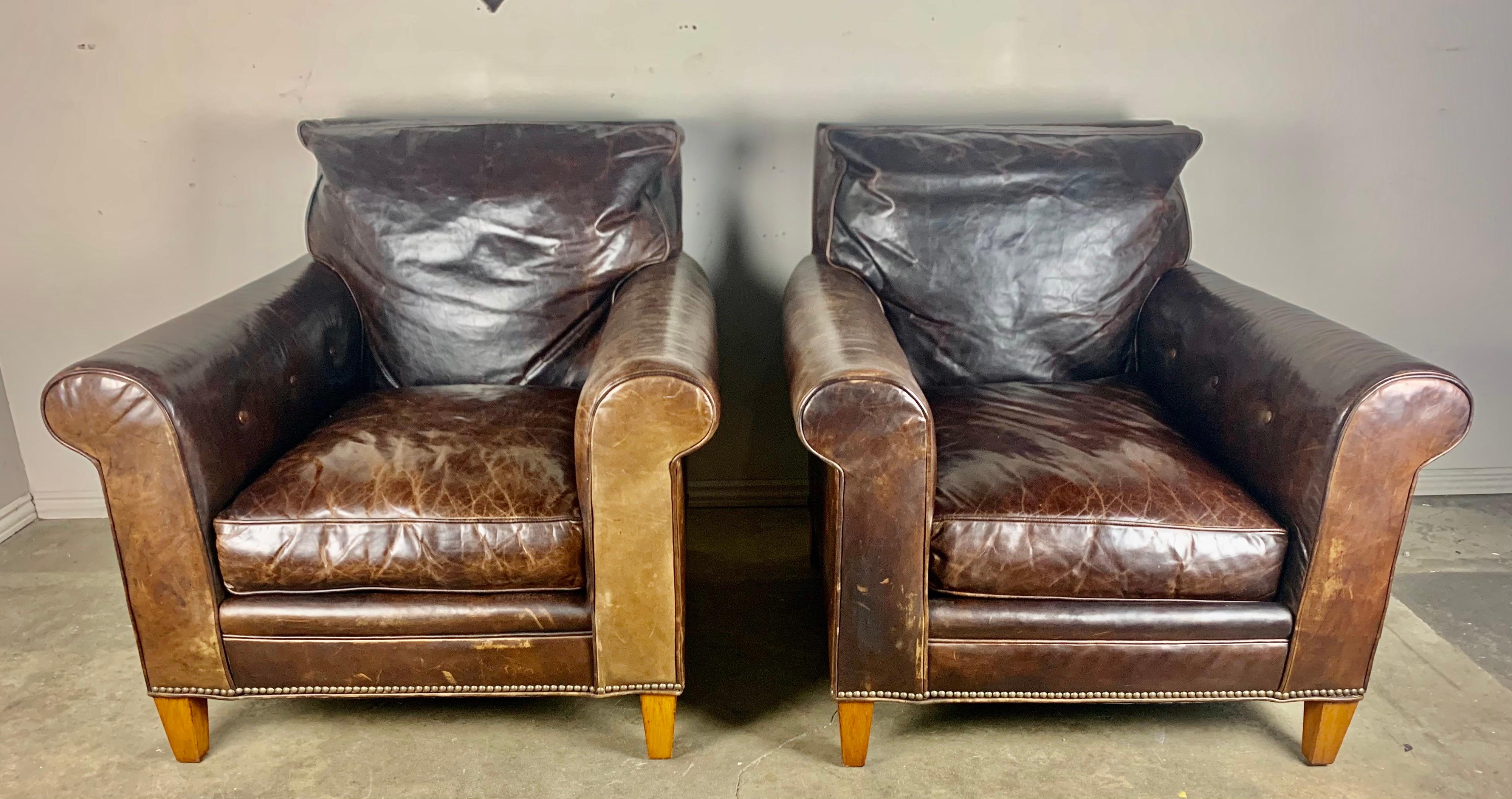 Pair of vintage Ralph Lauren leather club chairs from the mid-20th century. These classic style club chairs are upholstered in their original leather that has developed a gorgeous patina and have aged perfectly over the years. The chairs are