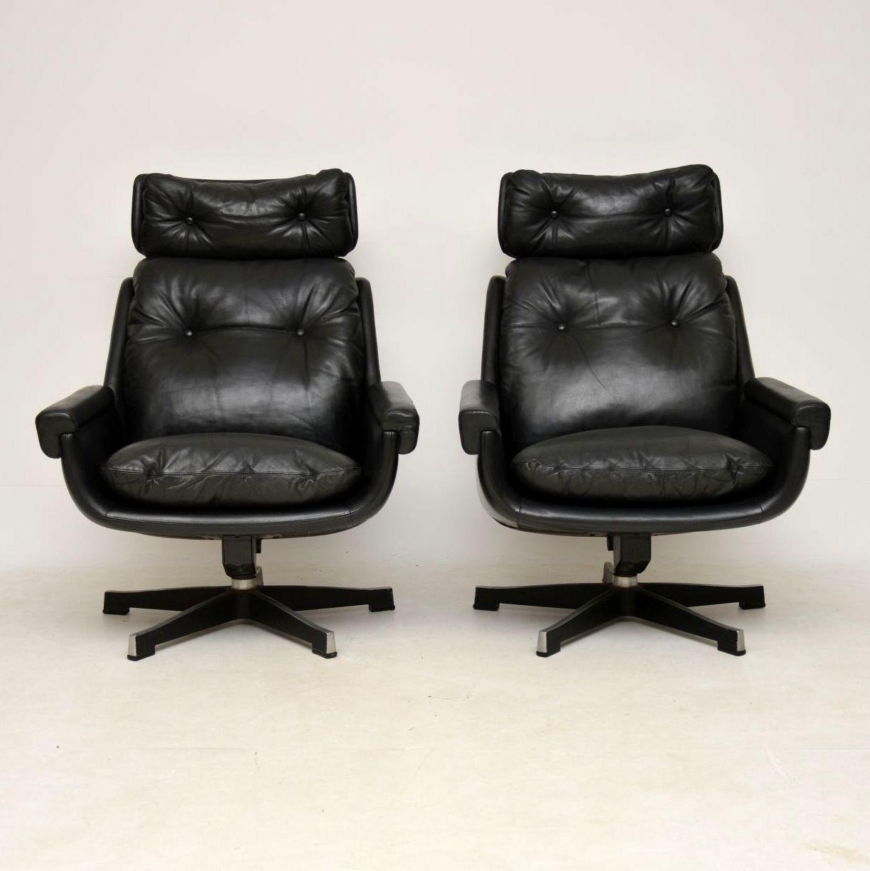 A stunning, top quality and unbelievably comfortable pair of vintage black leather armchairs, these were made in Finland by Peem, they date from the 1970s. They have a beautiful shape, sitting on well made splayed bases, they swivel and rock very