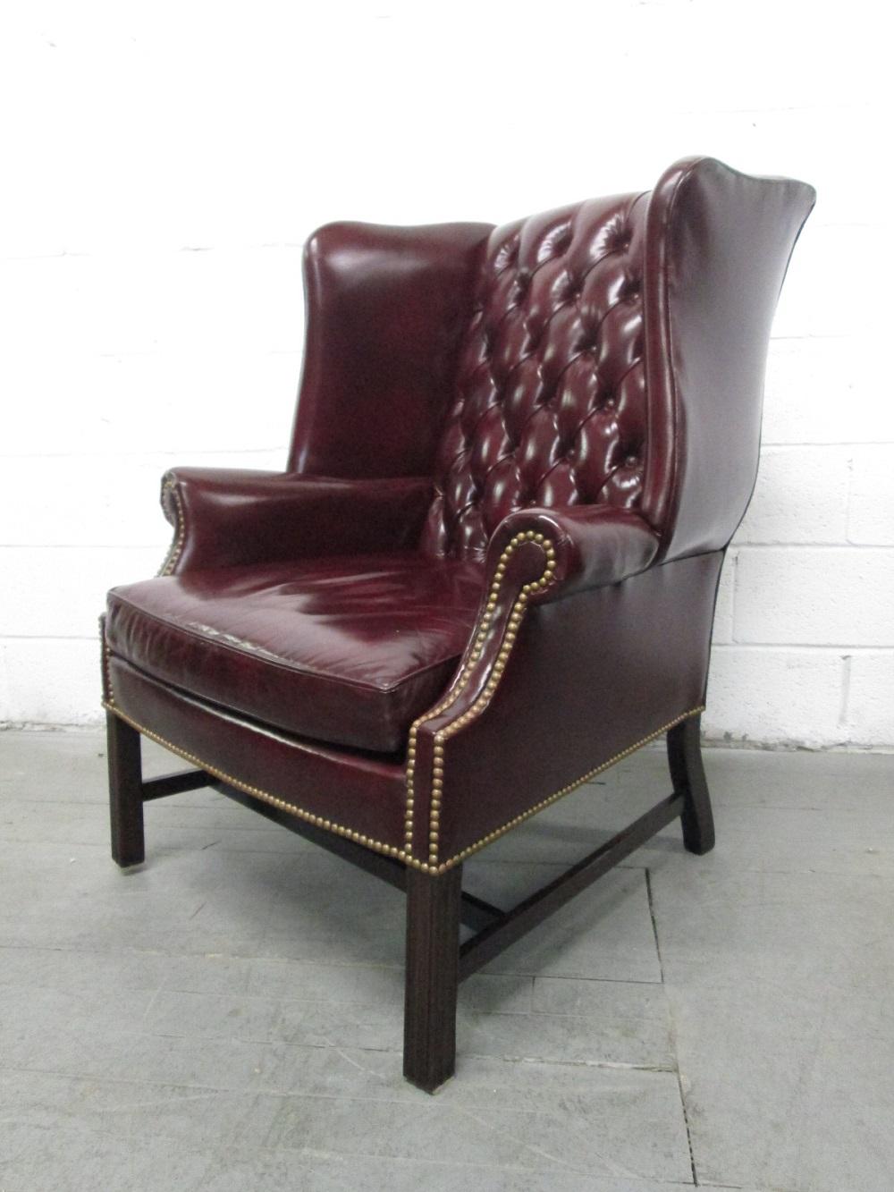 Mid-Century Modern Pair of Vintage Leather Tufted Wingback Chairs For Sale