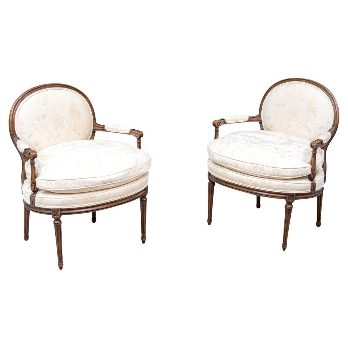 Pair Of Vintage Louis XVI Style Carved And Upholstered Fauteuils