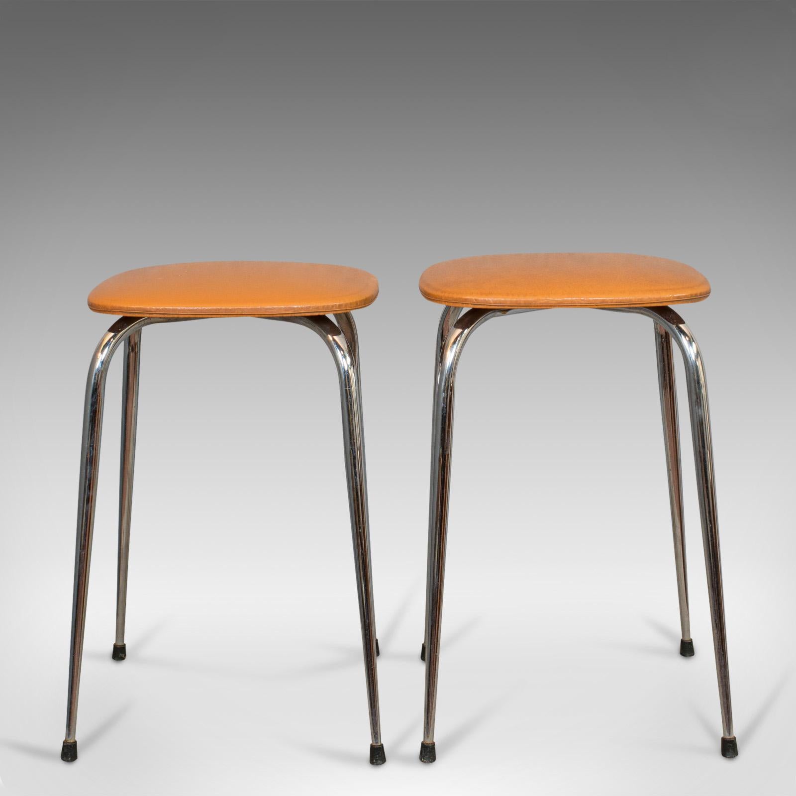 This is a pair of vintage lounge stools. A French, leatherette 1960s stool, dating the mid-20th century, circa 1960.

Add some French lounge chic with these vibrant 1960s stools
Displaying a desirable aged patina
Soft, tan leatherette in good