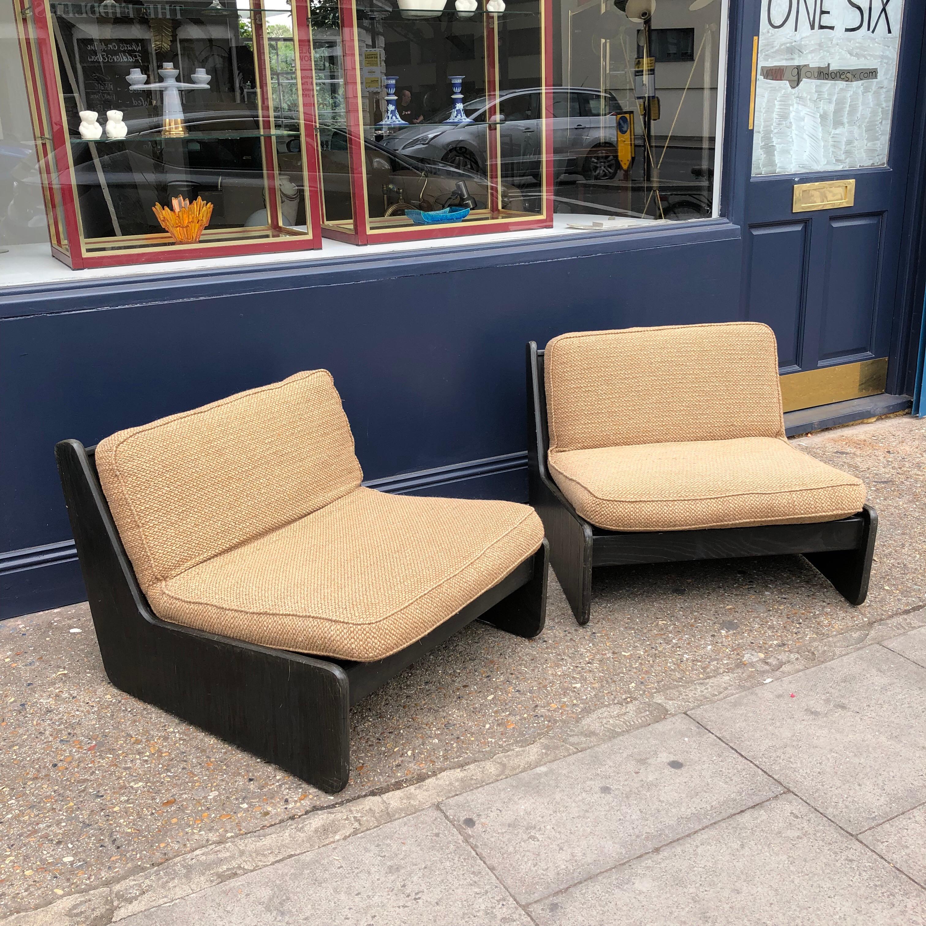 A pair of vintage low seat armchairs.
They would benefit new upholstery and webbing. In house upholstery and restoration available.
Five armchairs in total.
 