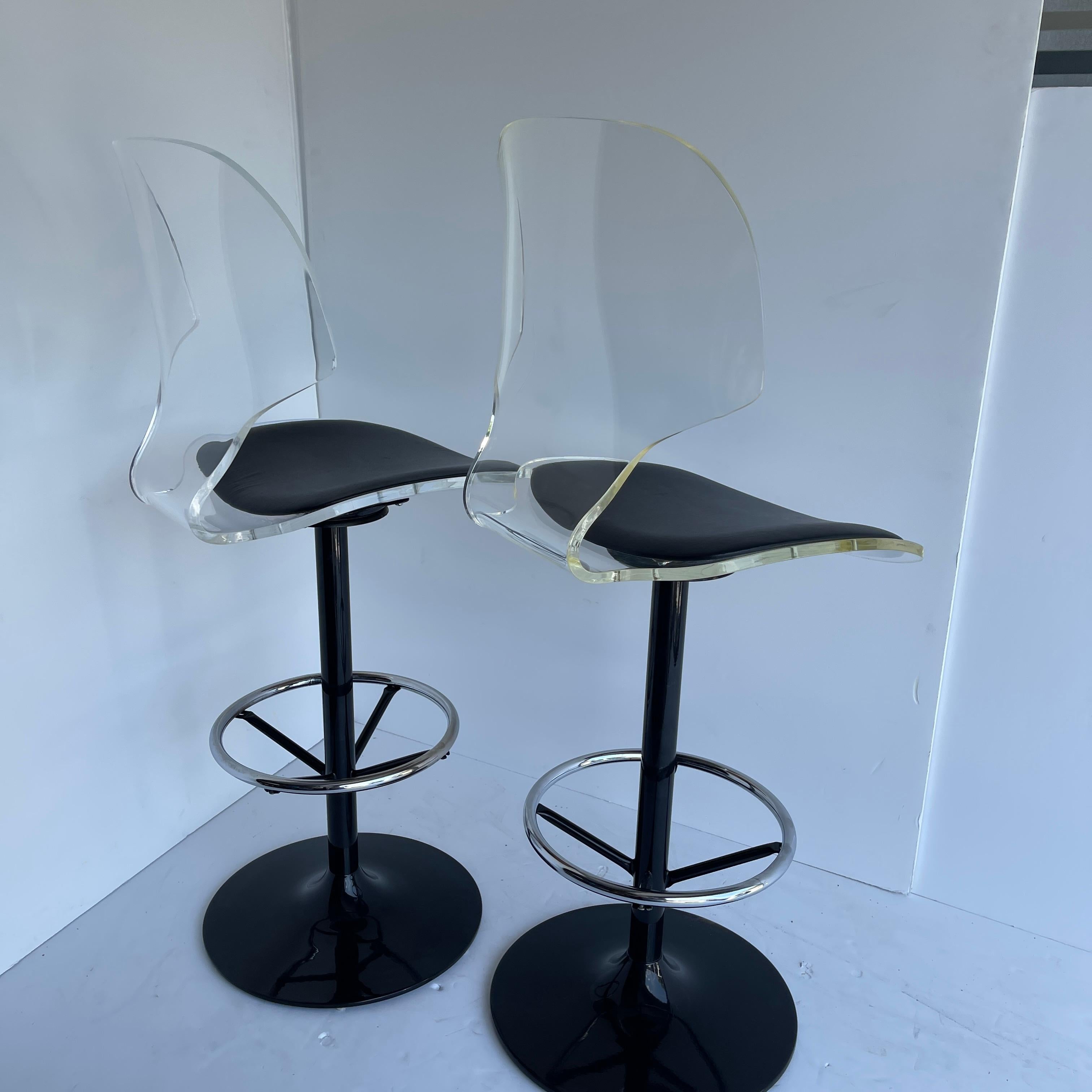 Faux Leather Pair of Vintage Lucite and Black-Painted Swivel Barstools For Sale