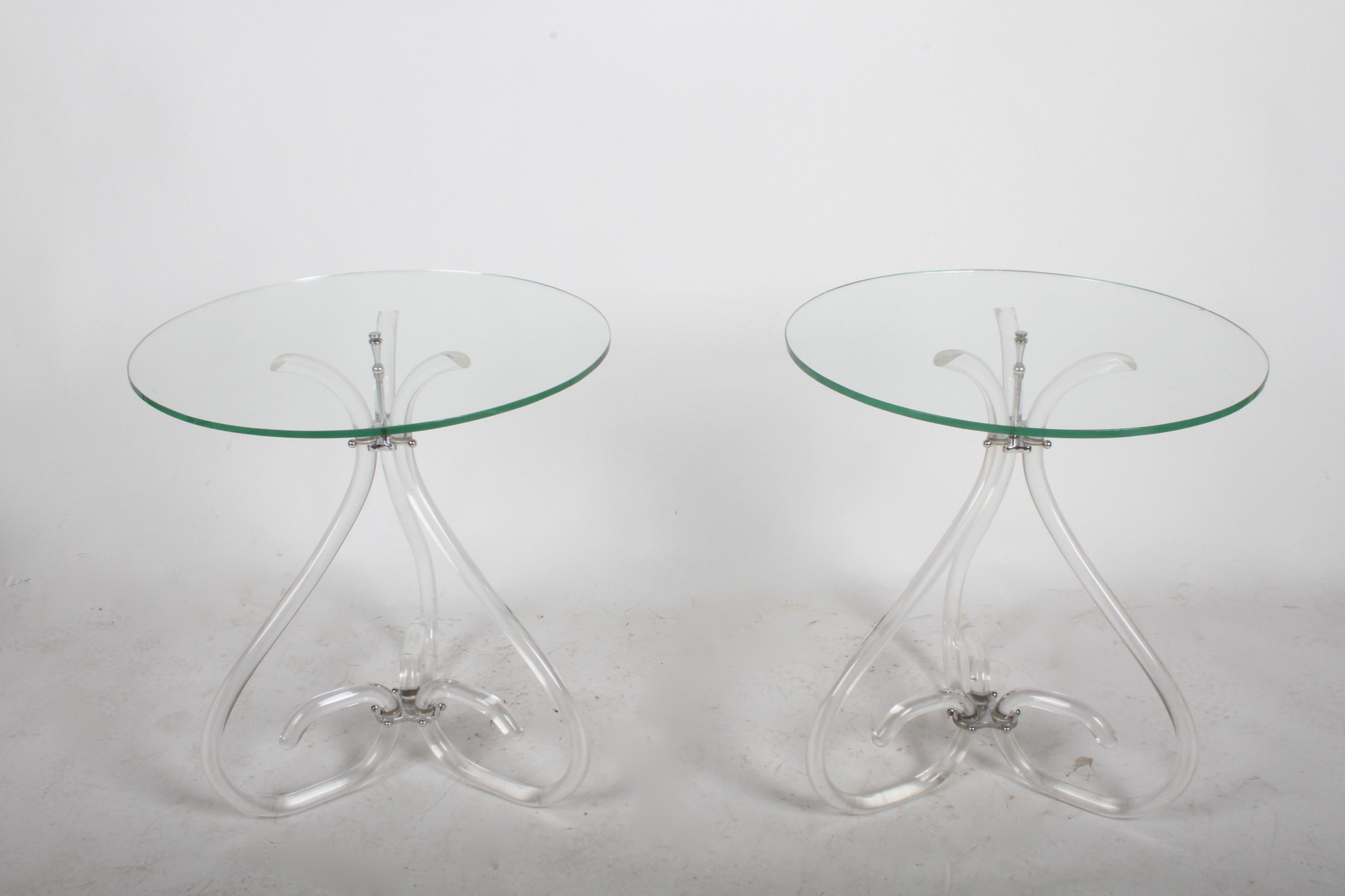 Elegant vintage Lucite and glass side tables in the style of Dorothy Thorpe, circa 1950s. Well constructed, having chrome plated hardware. Lucite is in nice original condition, no breaks or repairs, minor scuffs. Original glass tops have several