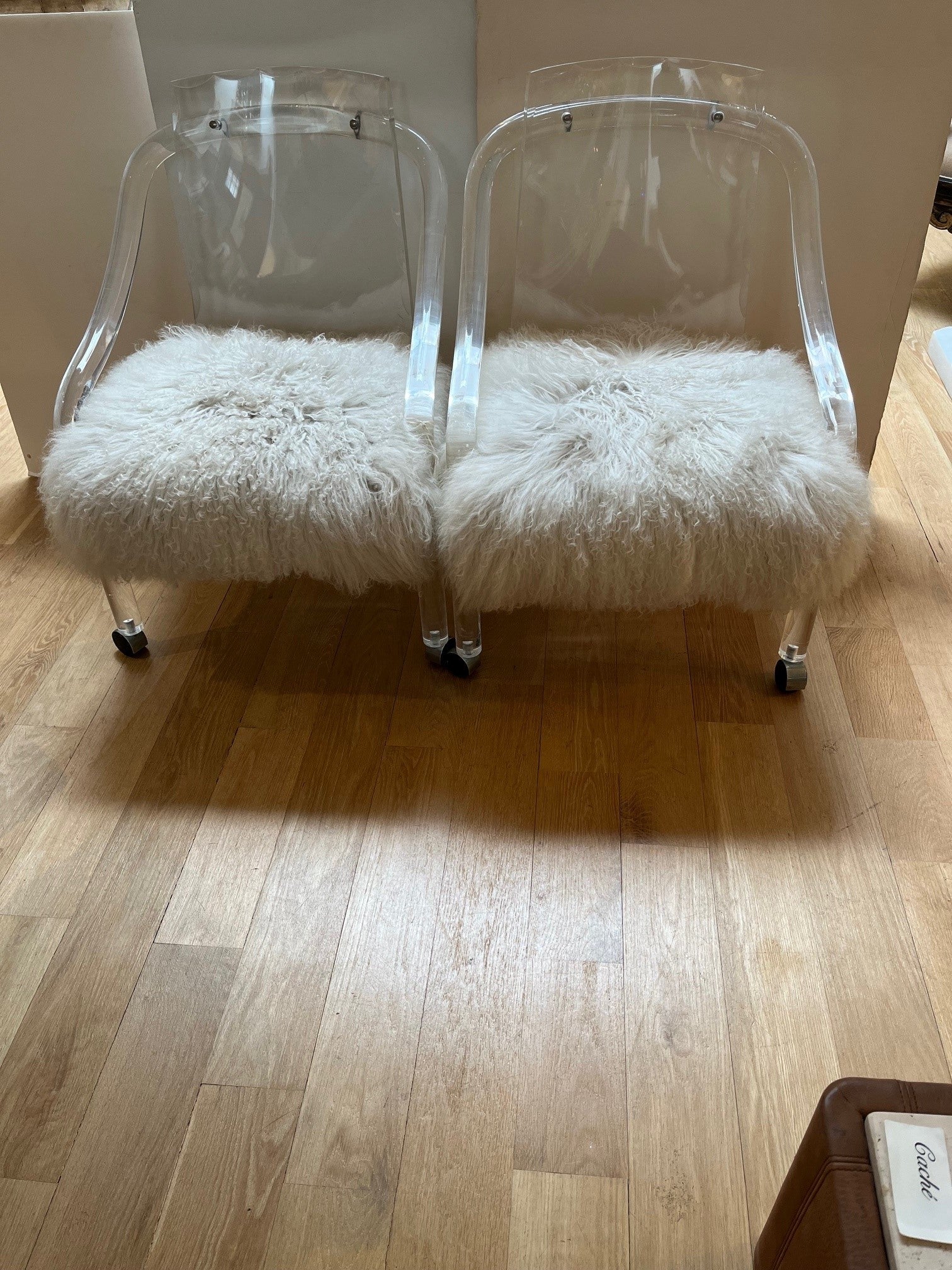 Pair of Vintage Lucite Armchairs Upholstered with Tibetan Lamb Fur Rug, Elegantly Detailed with Scalloped Backs and Graceful Sloping Arms.
***Please Note that these Vintage Pieces from the 1970s and We do make a Reproduction of this Chair for