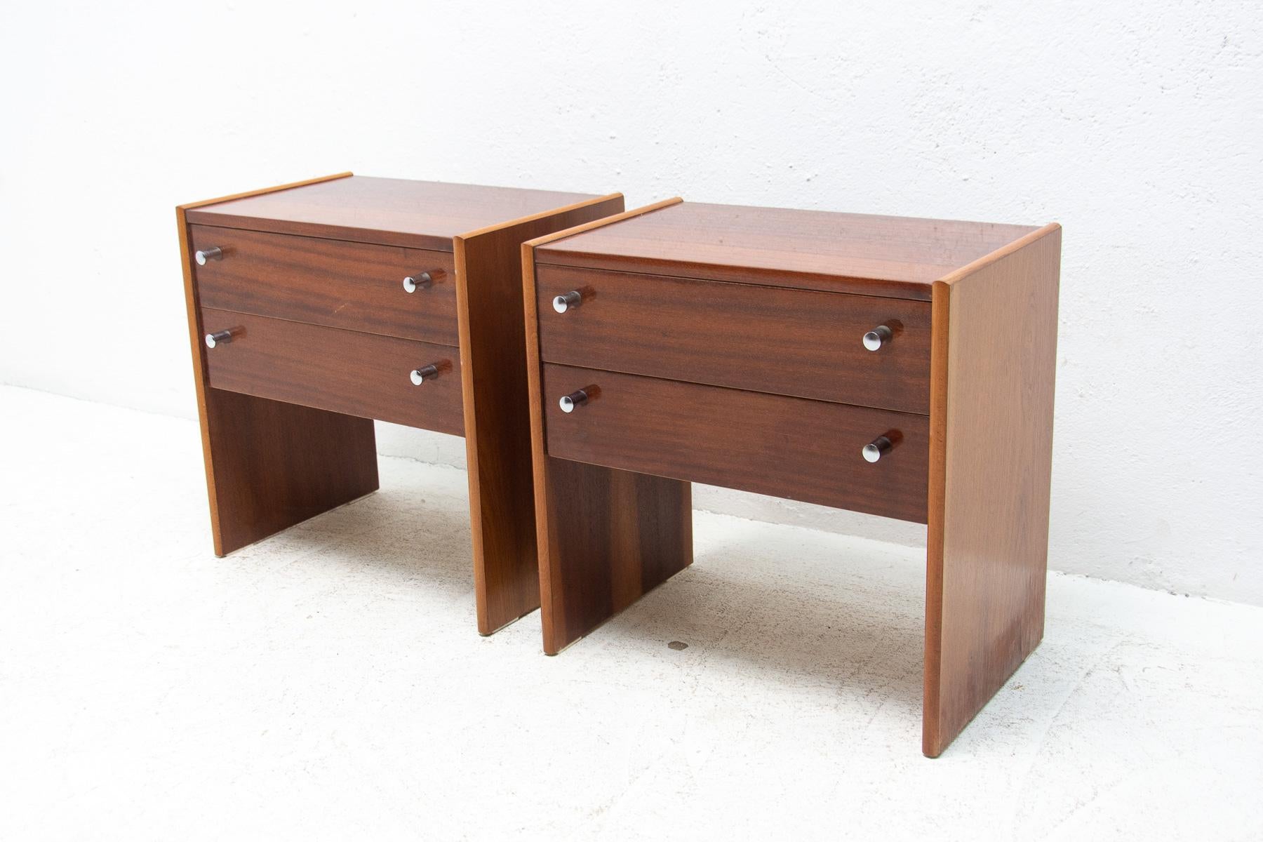 These Vintage bedside tables were made by UP Zavody company in the former Czechoslovakia in the 1980´s. Features a simple design, mahogany veneer. Overall in very good Vintage condition. Price is for the pair.

Measures: Height: 50 cm

width: 50