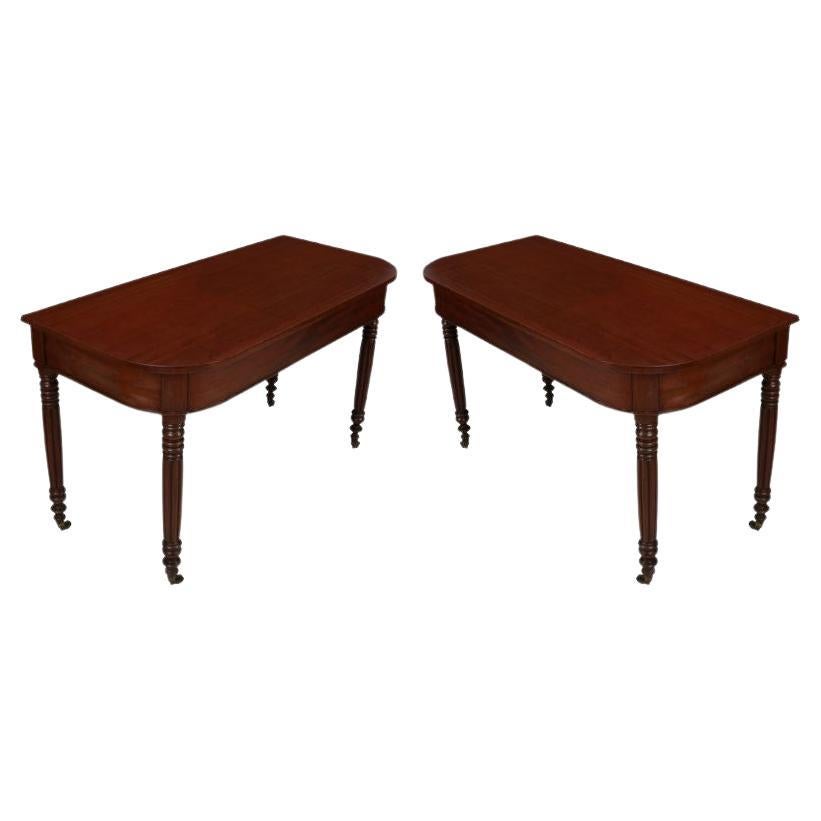 Pair of Vintage Mahogany Demilune Tables with Fluted Legs and Wheels For Sale