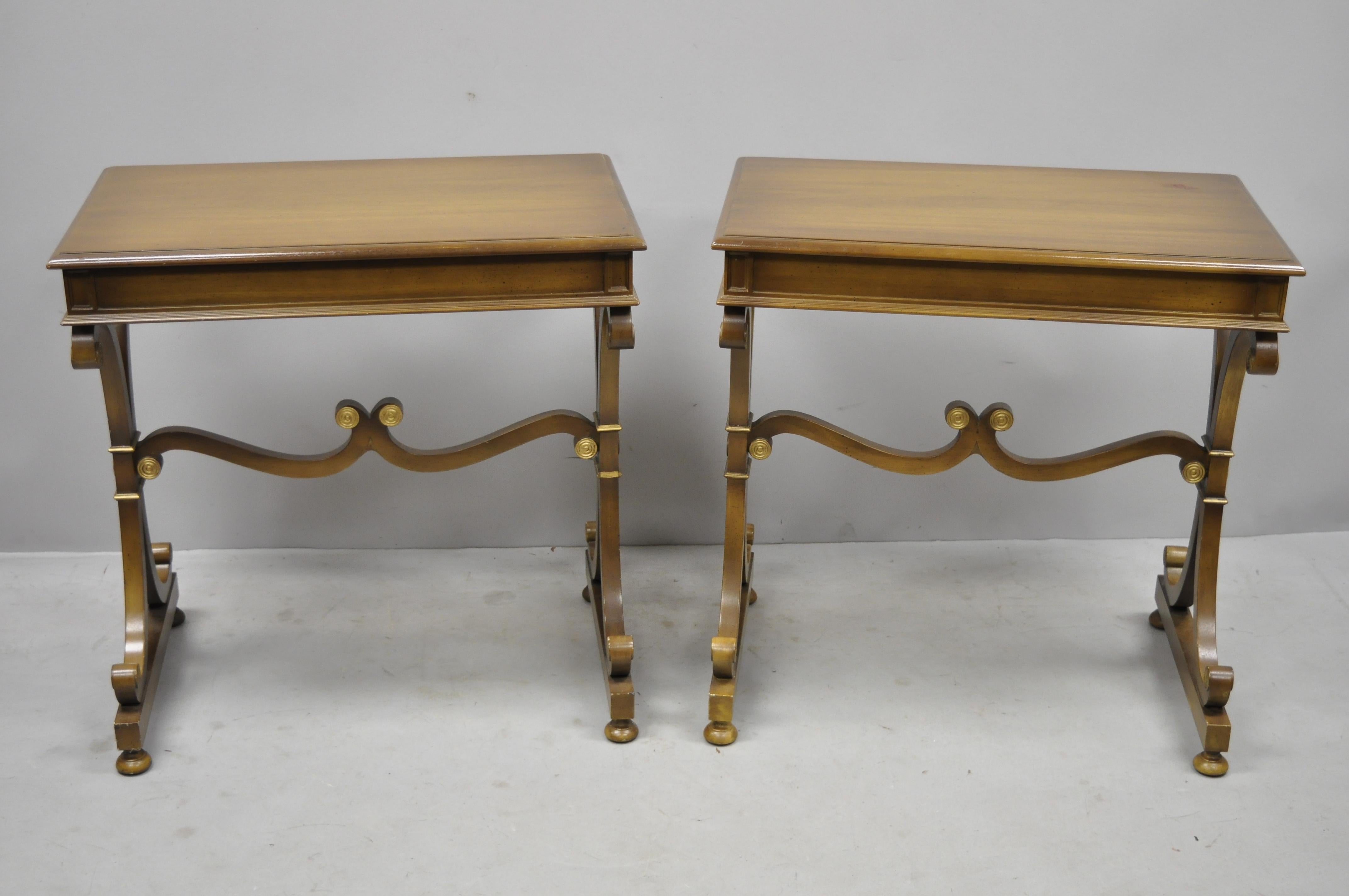 Pair of vintage mahogany Regency style X-frame lamp side end tables by J. Zonon. Items feature pullout / pull-out leather top surfaces on both sides, X-form supports, gold painted accents, original stamp, quality American craftsmanship, great style