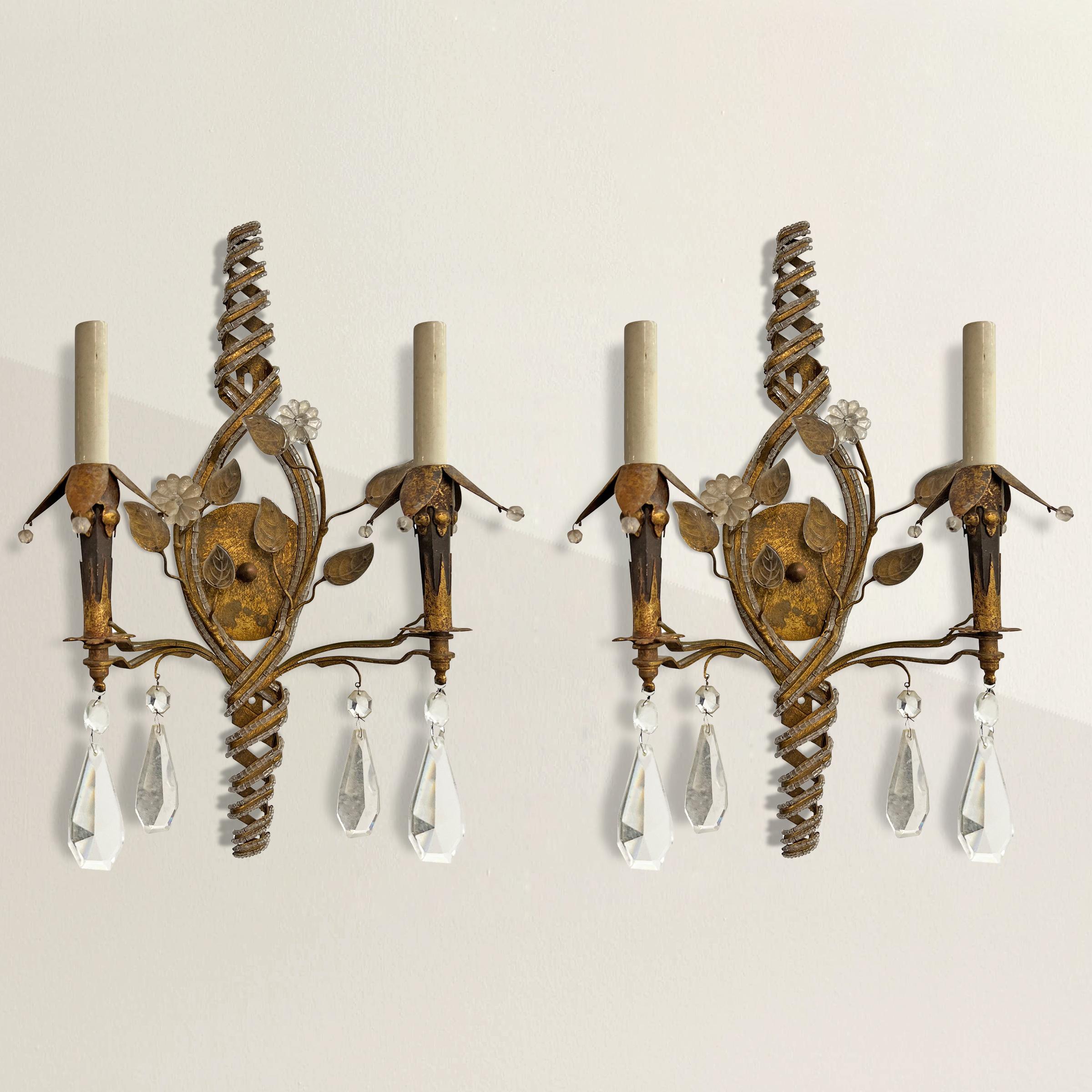 Immerse your space in the timeless elegance of vintage French design with this exquisite pair of Maison Baguès two-arm sconces. Crafted by the renowned Maison Baguès, a bastion of luxury lighting and furniture since 1840, these sconces are a