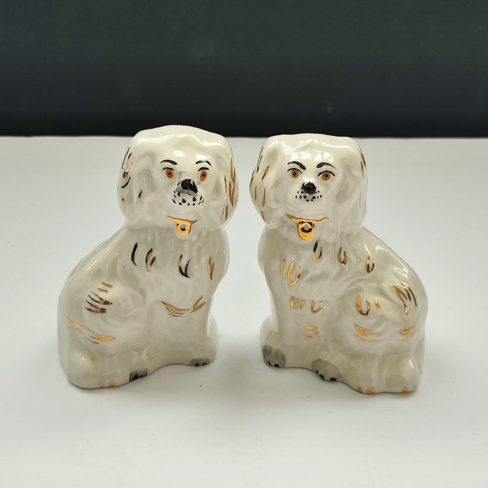 Nice pair of vintage miniature Staffordshire mantle dogs. They measure approximately 9 cm [3.5
