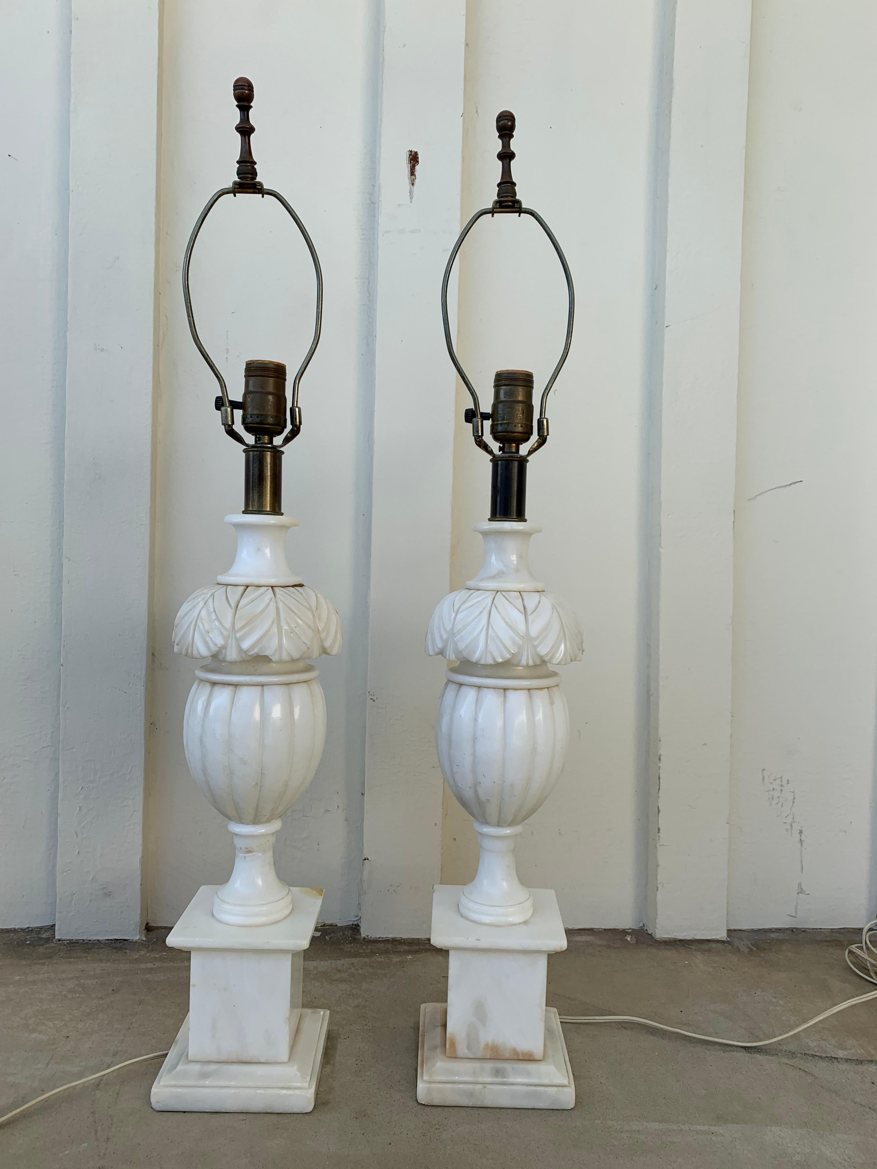 Beautiful pair of matching marble lamps with beautiful forms.The lamps are at least from the 50s and they have the original wiring. the lamps have not shades.

Meeasurements:
22 inches high from floor to top of light socket x 30.5 high to top of
