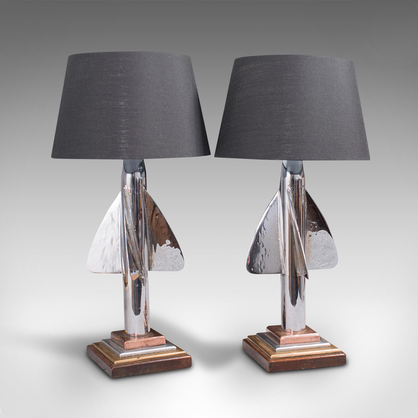 This is a pair of vintage maritime desk lamps. An English, chromed ship's log trailing fin table light, dating to the early 20th century and later, circa 1930.

Fascinating nautical forms with eye-catching finish
Displays a desirable aged patina