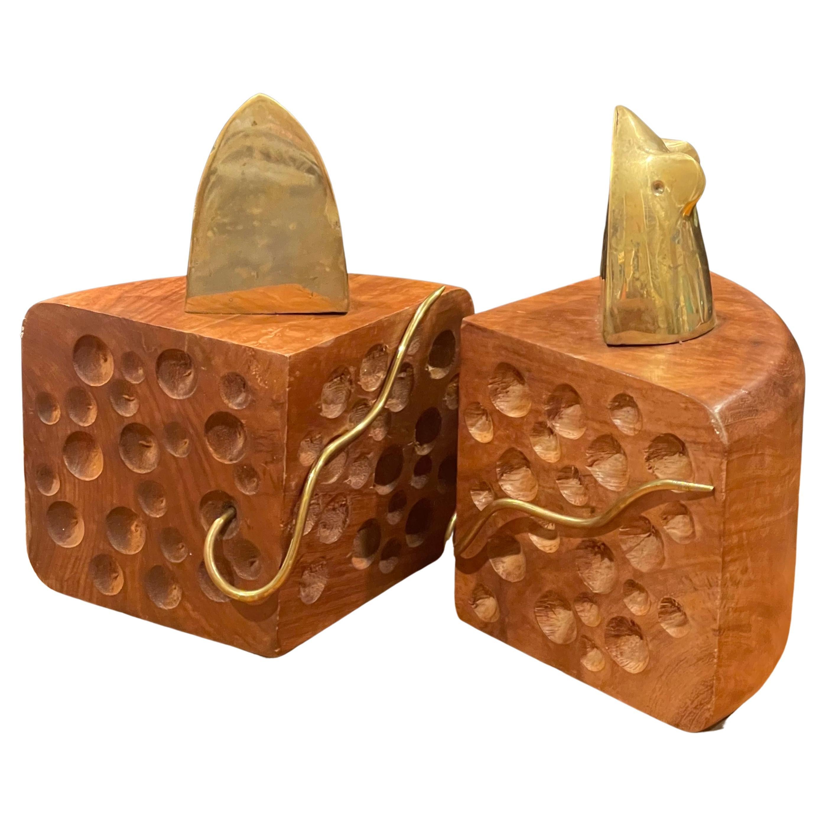 A whimsical pair of vintage MCM brass mouse on walnut cheese wedge bookends, circa 1970s. The bookends are in very good vintage condition and measure 8.25