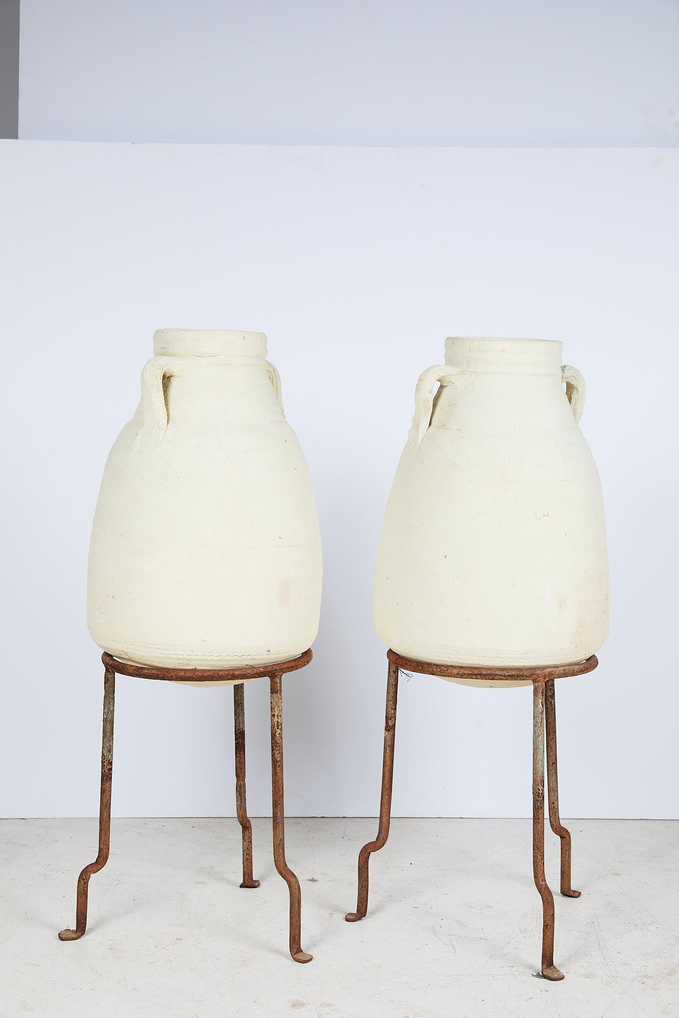 Pair of Vintage Mediterranean White Clay Vessels on Forged Iron Stands In Good Condition In Atlanta, GA