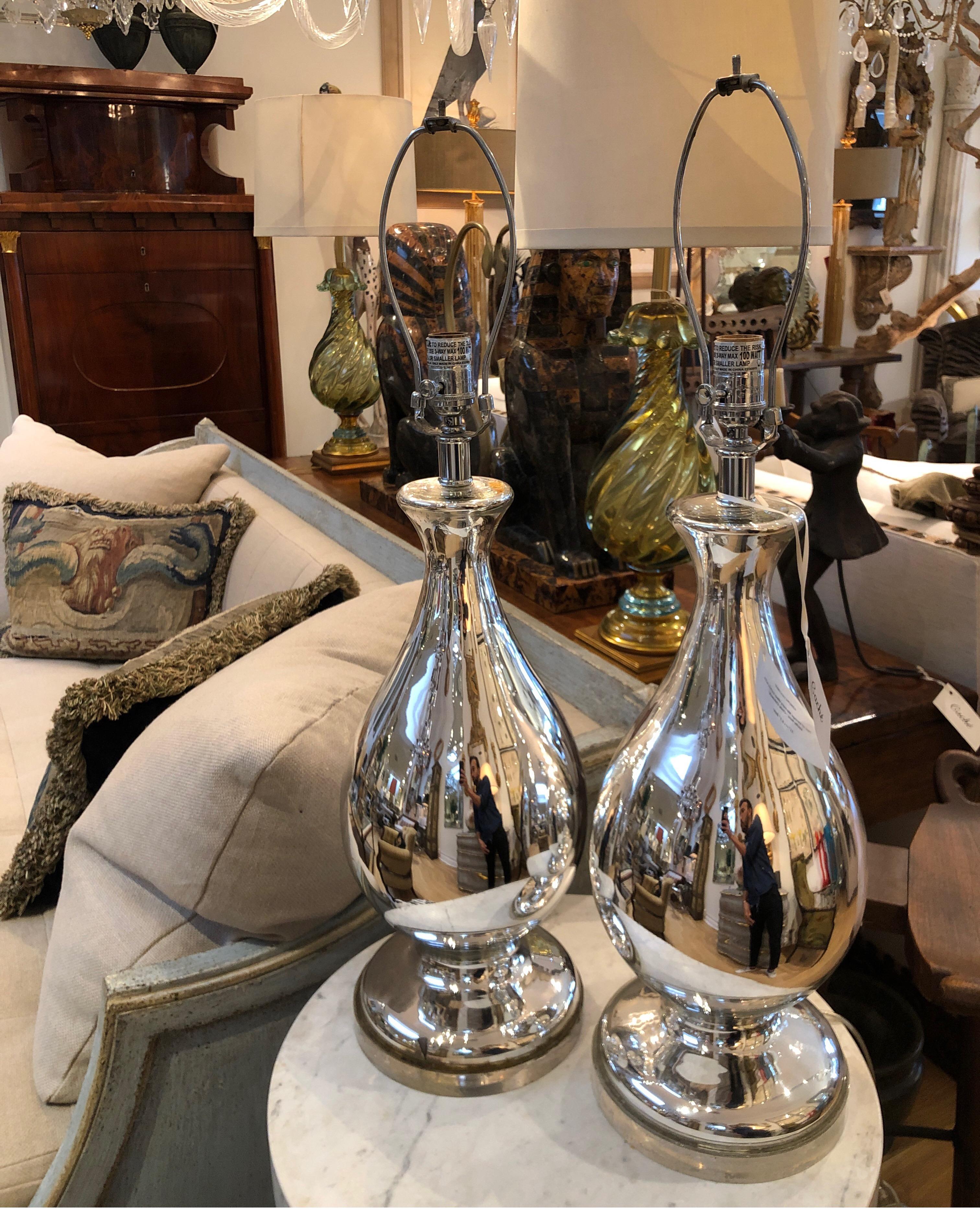 Pair of mercury glass lamps by Cindy Ciskowski. Each lamp sits on a Lucite base with nicks/chrome hardware.
Measures: 31