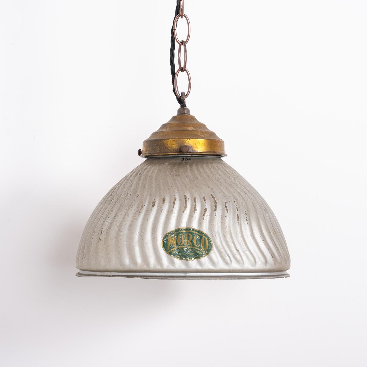 A Stunning Pair of Mercury Glass Pendant Lights
Price is for the pair
Moulded glass shades with a waved ridged pattern, original aged paint to the external and foxed silvered glass internals with aged brass fittings and chain.

Original makers marks
