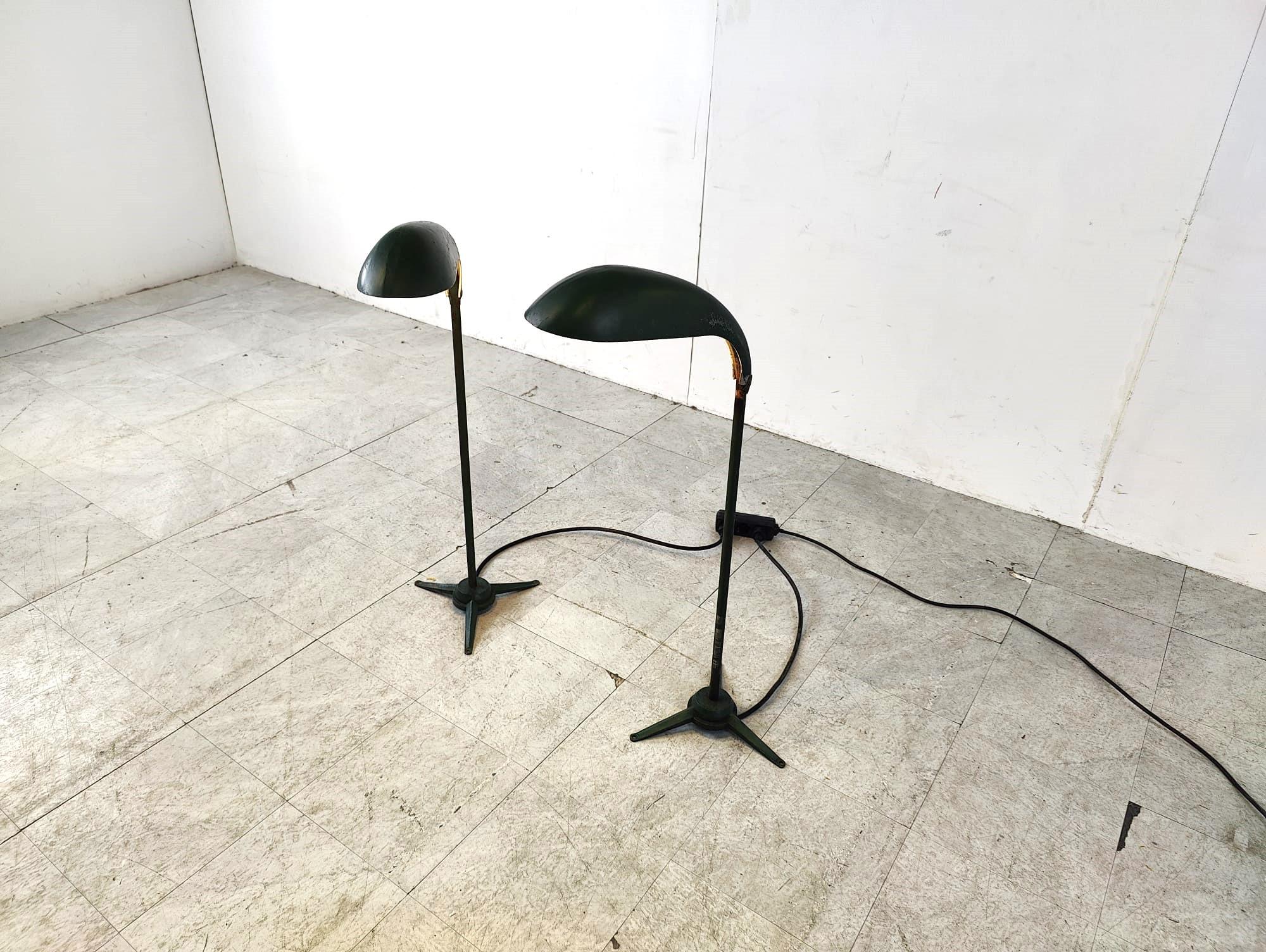 Pair of vintage floor lamps made from dark green metal.

They have nicely s haped shades and a tripod base.

They can be used in and outdoor.

Beautiful patina.

Tested and ready to use.

1970s - Belgium

Dimensions:
Height: 95cm
Width: 45cm
Depth: