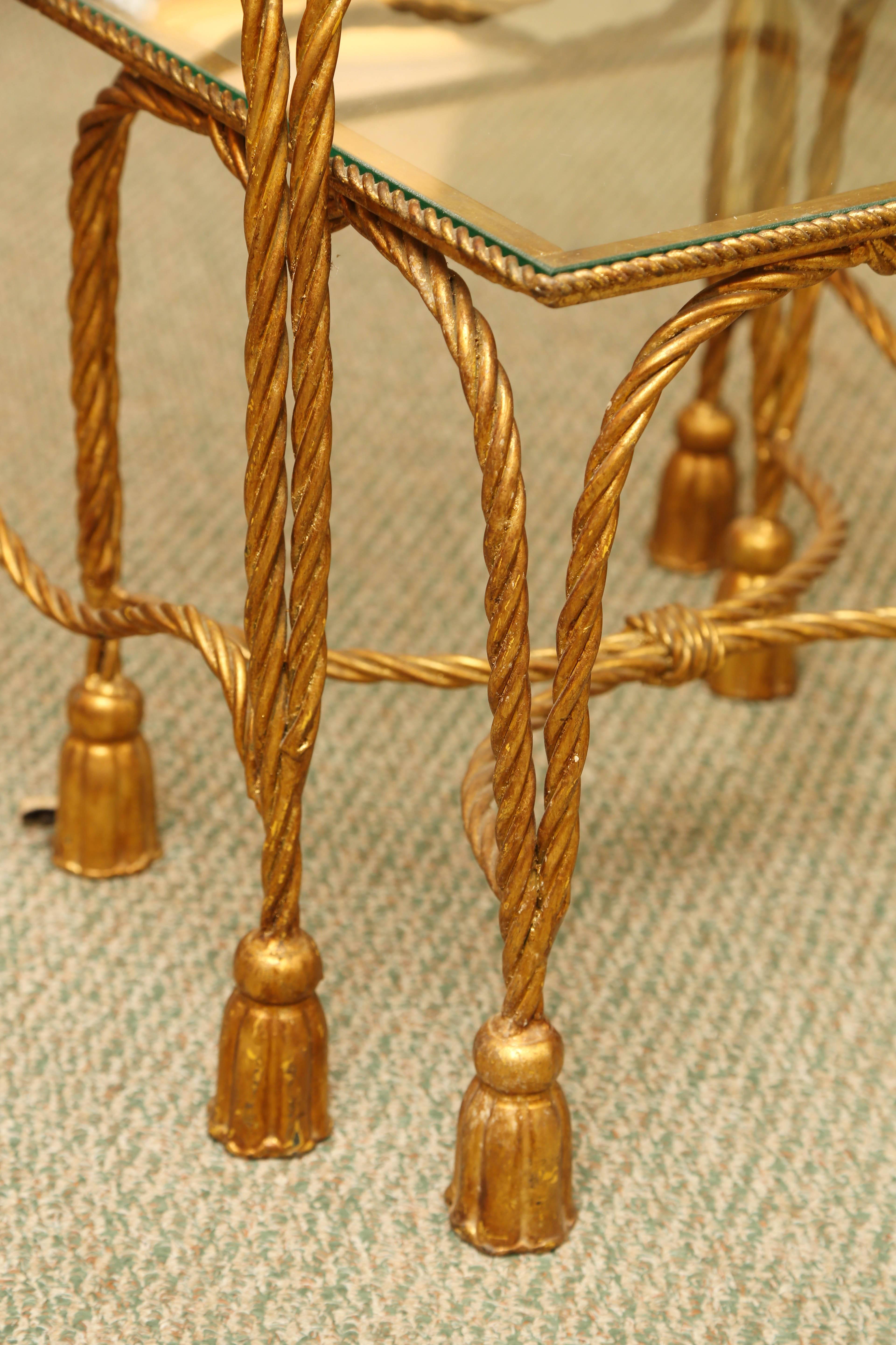 Vintage pair of metal rope and tassel nesting tables with glass top.
Bottom tables 15 D, 21 W, 16 H.