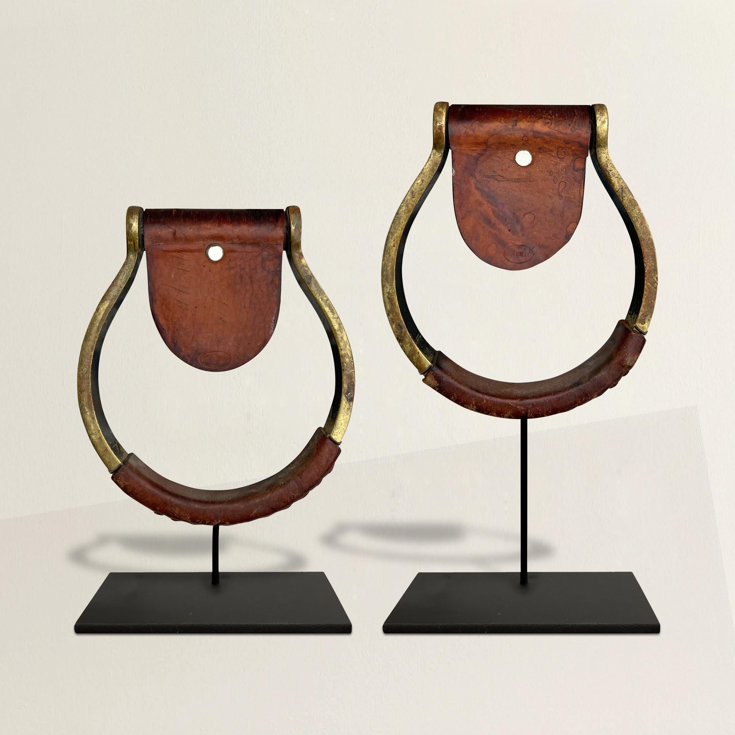 These vintage Mexican hand-stitched leather wrapped brass stirrups are an exquisite blend of craftsmanship and equestrian heritage. Each stirrup has been meticulously crafted, showcasing the skill and artistry of Mexican artisans. The lustrous brass