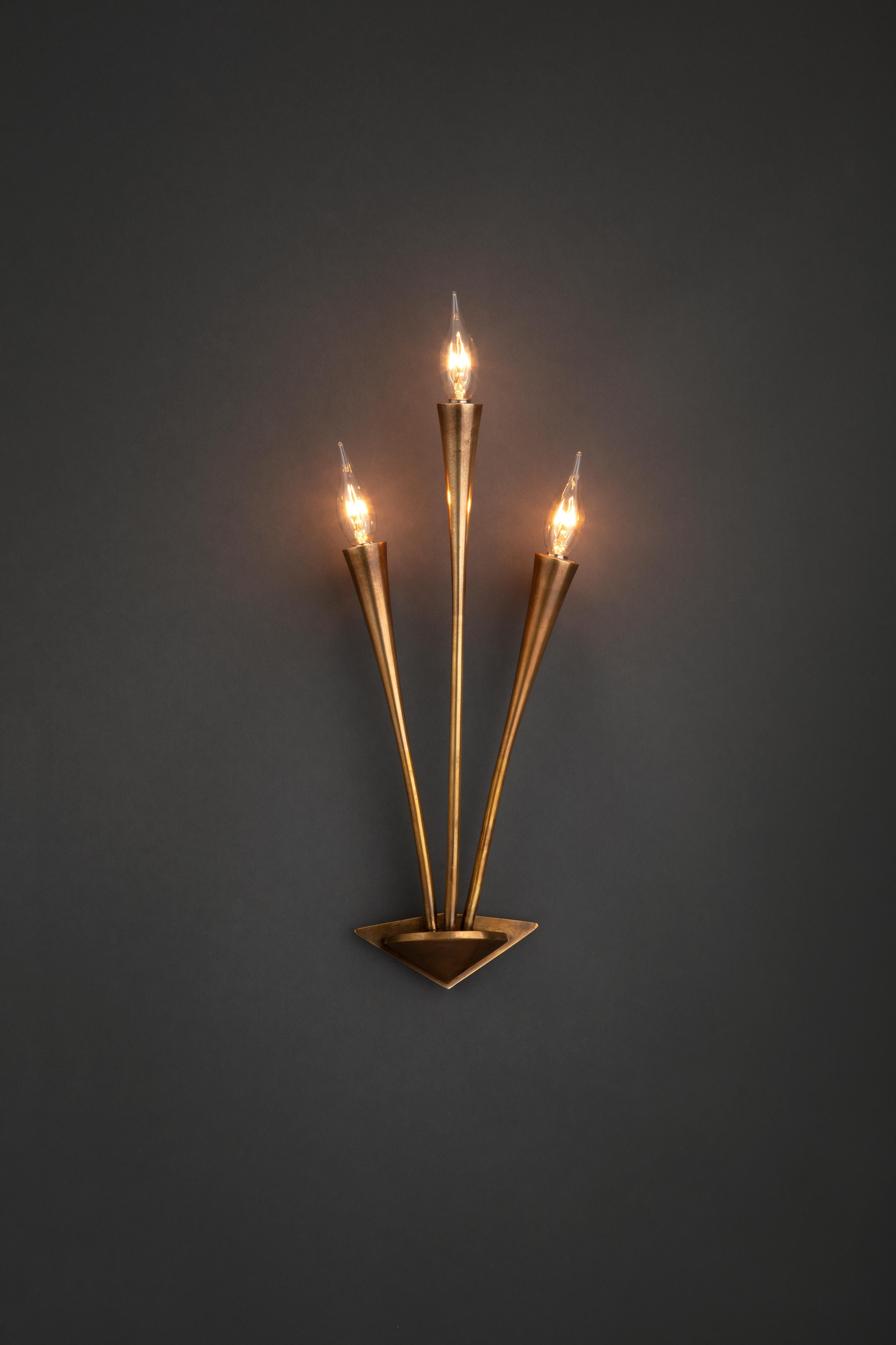 Triple arm mid century sconces in brass. 

Takes 3 E10 bulbs. Wired for the EU.