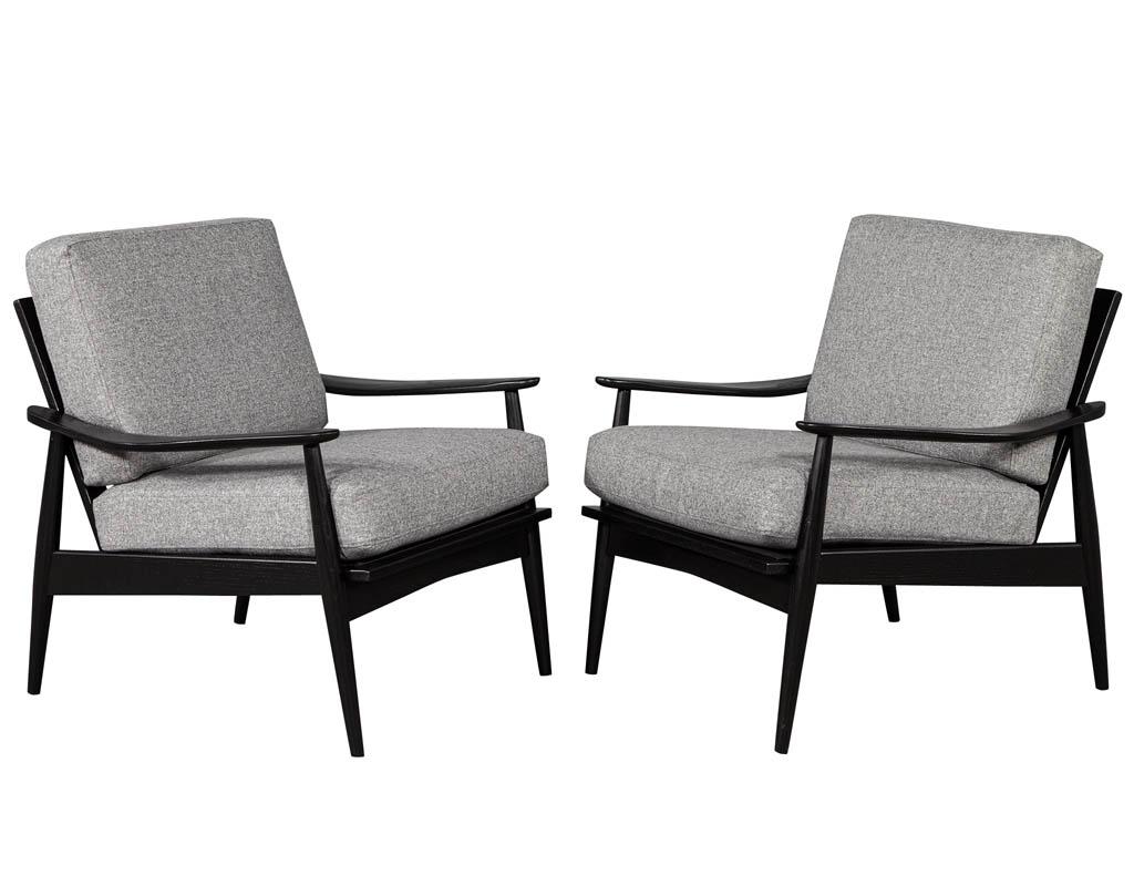 Pair of Vintage Mid-Century Modern Lounge Chairs. Recently restored in a hand rubbed ebony finish and reupholstered in a designer linen fabric.

Price includes complimentary scheduled curb side delivery to the continental USA.