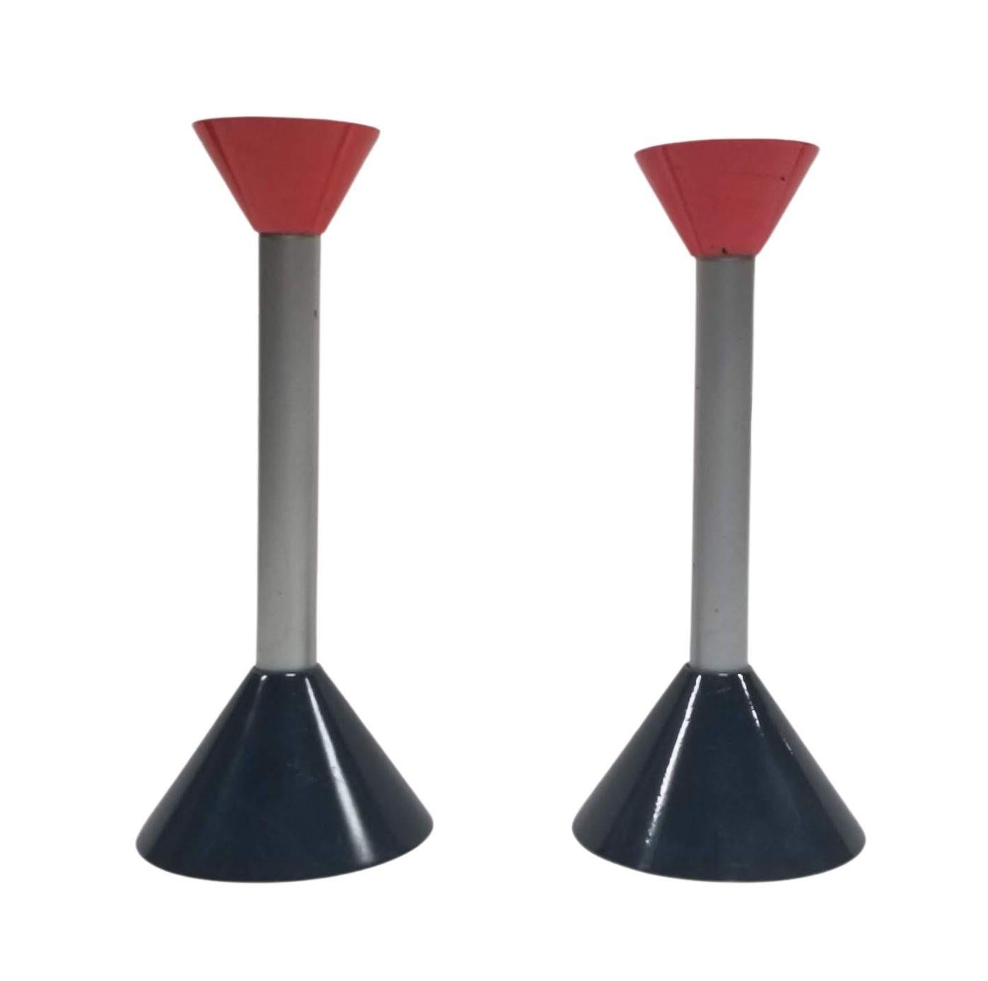 Elevate your decor with this stunning pair of Vintage Mid Century Memphis Age Postmodern Candlestick Holders. These unique pieces showcase a fusion of mid-century charm and postmodern flair, featuring intricate design elements that effortlessly