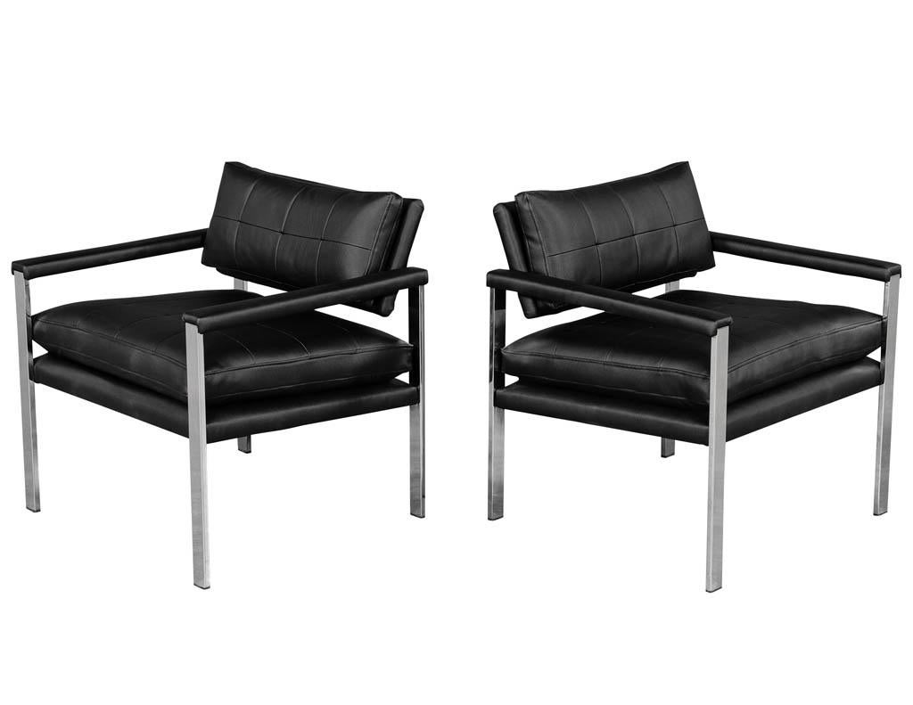 Pair of vintage Mid-Century Modern armchairs in metal. Polished stainless steel frame and black perforated vinyl material. Restored and reupholstered.

Price includes complimentary scheduled curb side delivery service to the continental USA.