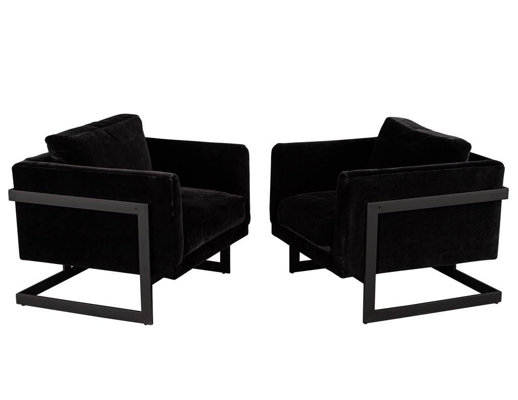 Pair of vintage Mid-Century Modern black lounge chairs. Original 1970's design from USA, fully restored with a black velvet and baked black powder coated metal frame.

Price includes complimentary curb side delivery to the continental USA.
