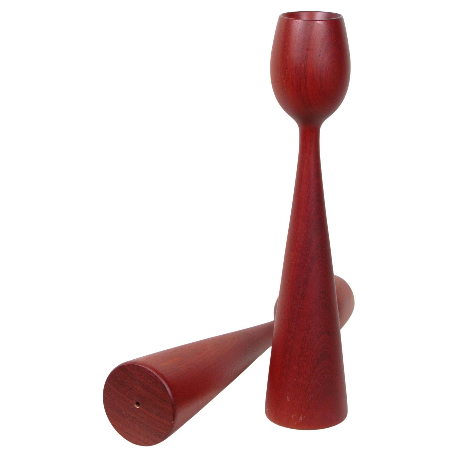 Embrace the timeless elegance of mid-century Danish design with this beautiful pair of vintage teak candlestick holders. Crafted from rich, warm teak wood, these pieces exemplify the minimalist yet sophisticated aesthetic that defines the era.

Both