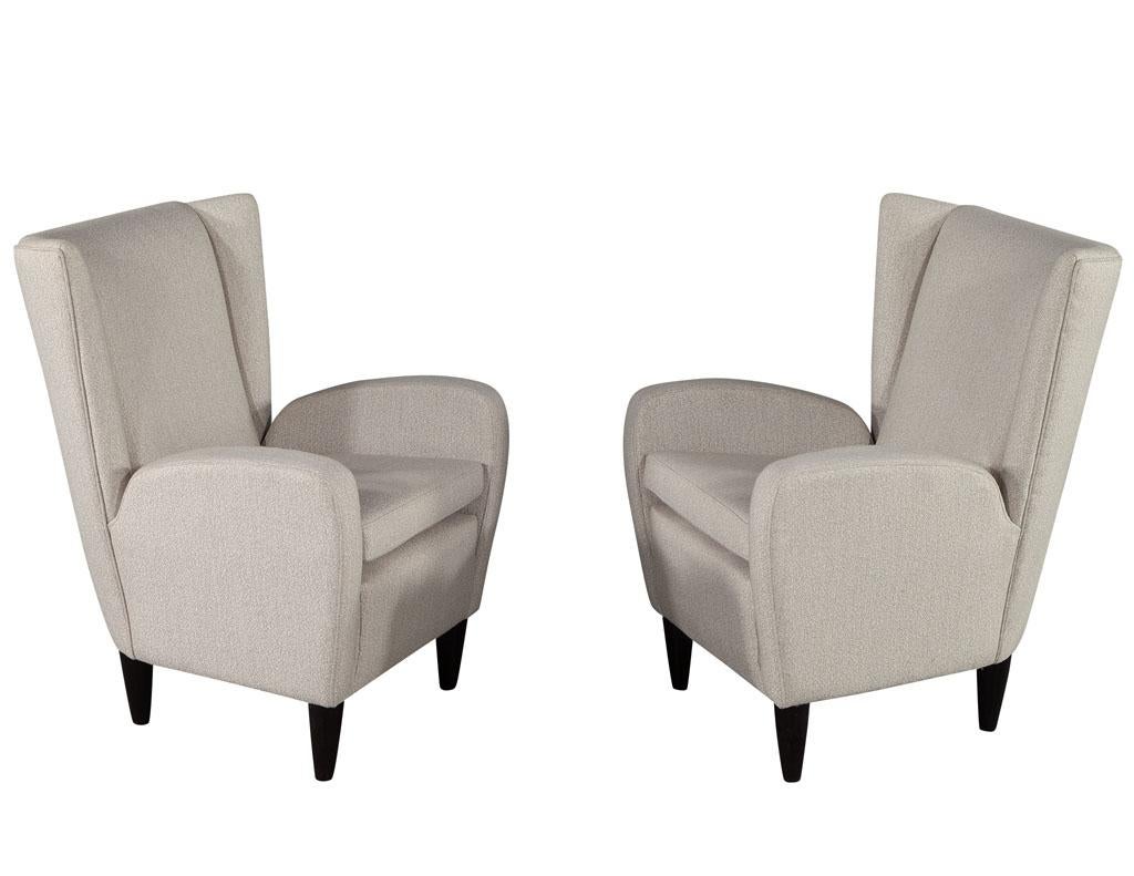 Pair of Vintage Mid-Century Modern Italian paolo buffa wingback lounge chairs. Iconic paolo buffa styling, Italy, circa 1960’s. Masterfully restored to its original condition with new textured fabric upholstery and satin black finished legs. Price