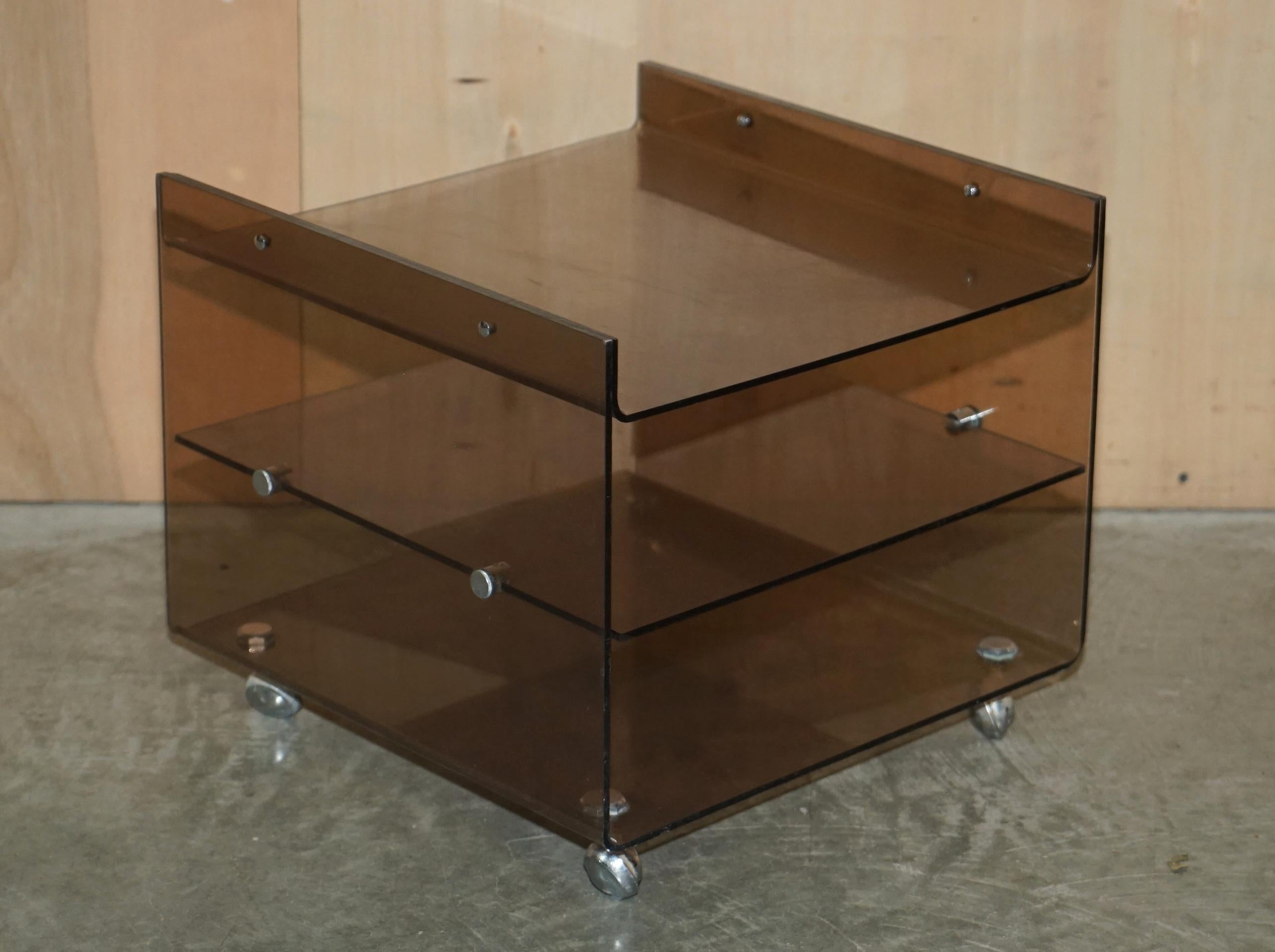We are delighted to offer for sale this lovely original pair of circa 1960’s Mid-Century Modern plexiglass side tables on the original castors by Eric Maville.

A very cool and well made pair of retro side tables, they look elagent and